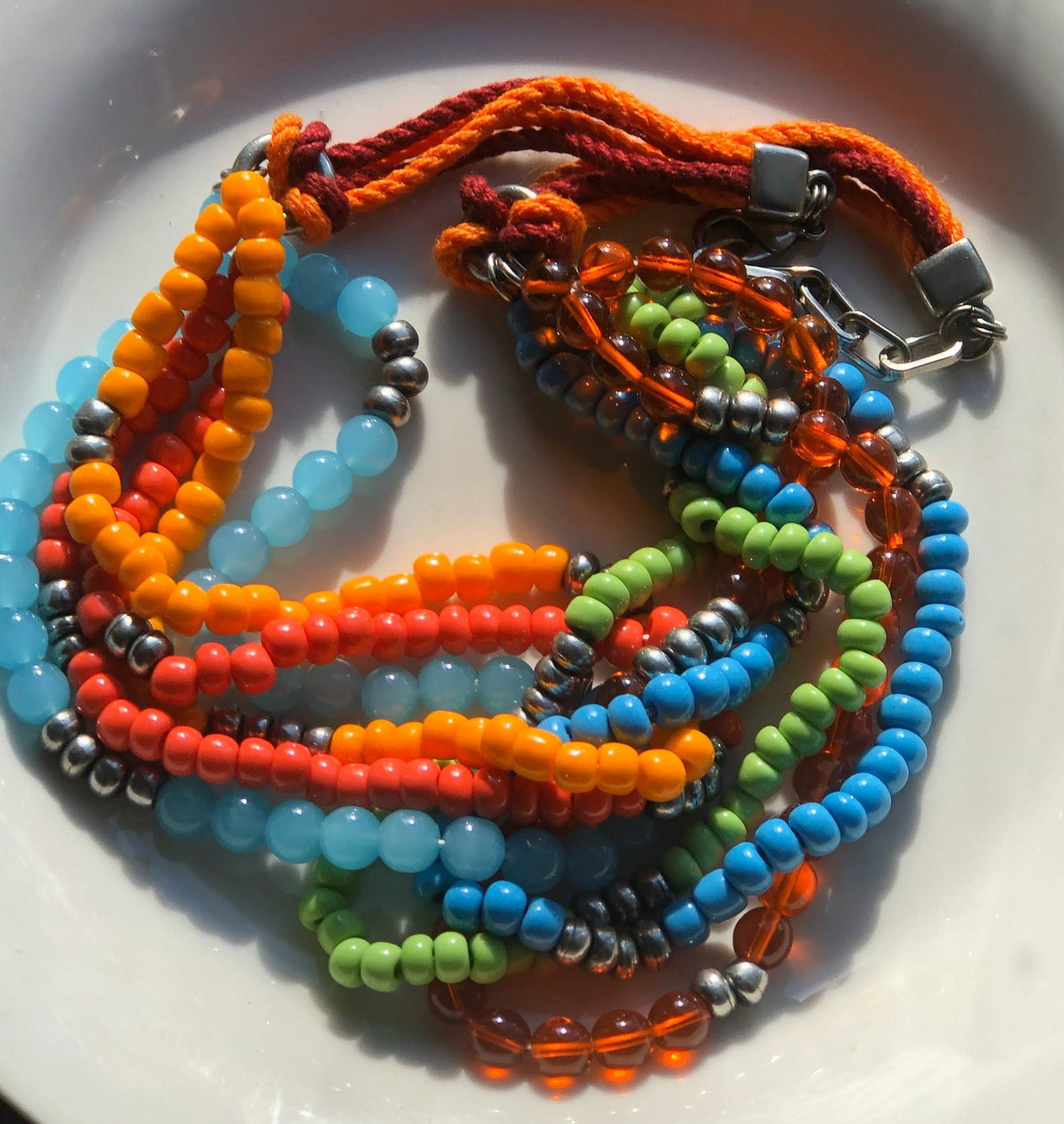 Colorful Beaded Necklace: A vibrant, multi-colored beaded necklace with adjustable clasp.