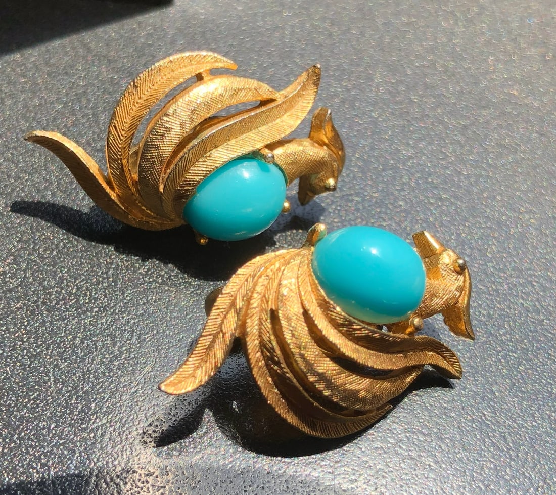 Elegant vintage earrings featuring gold-toned metal with blue stones: Elegant vintage earrings featuring gold-toned metal with blue stones