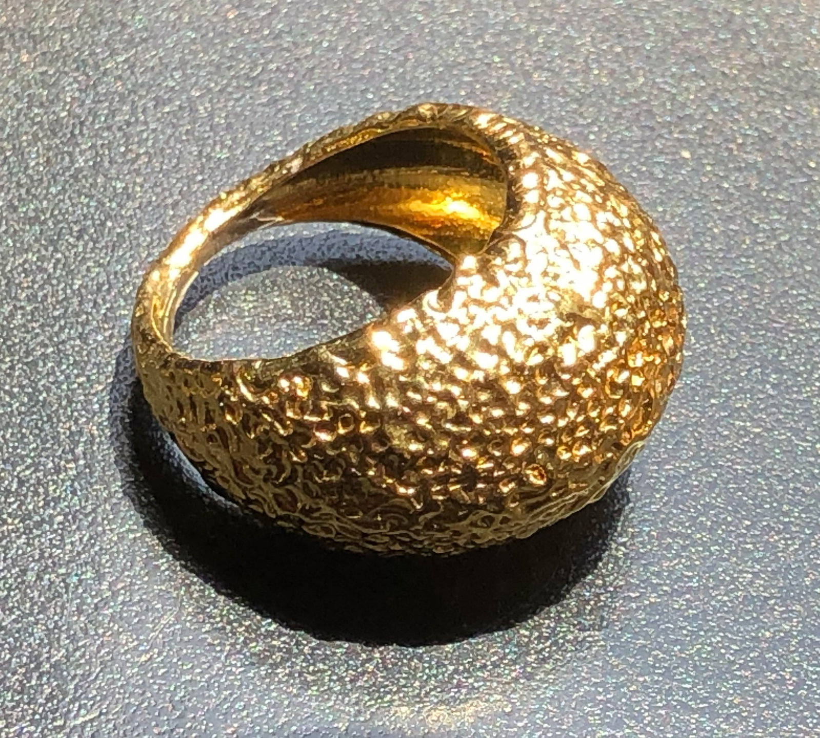 A beautifully crafted textured gold color ring with a unique design, Size 7. (1 of 3)
