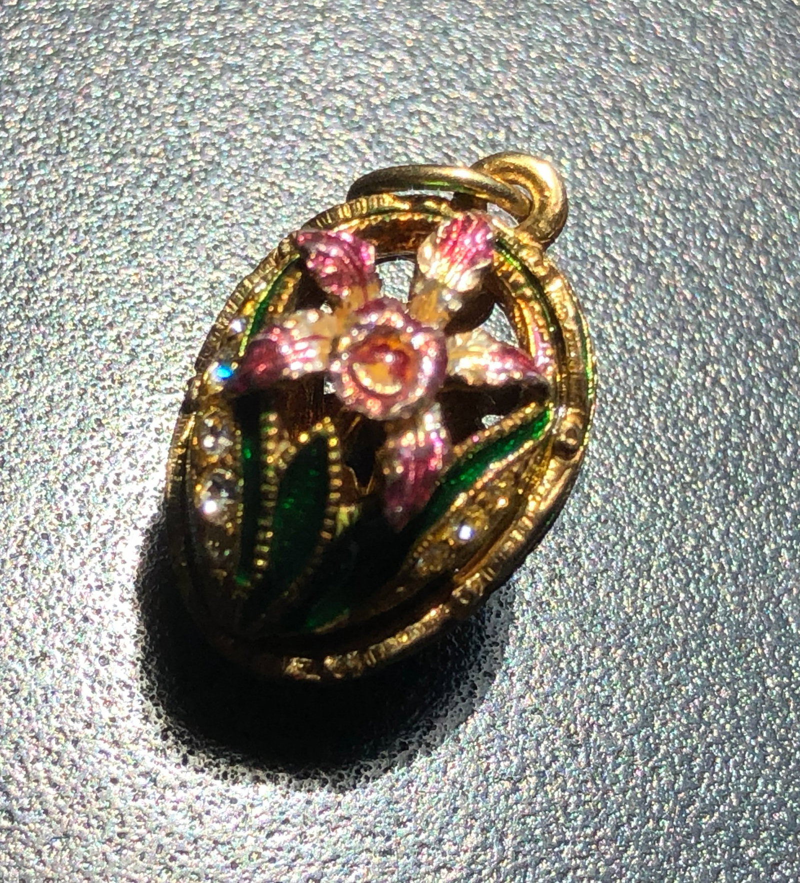 A beautifully crafted floral silver pendant with intricate details and vibrant colors: A beautifully crafted floral silver pendant with intricate details and vibrant colors