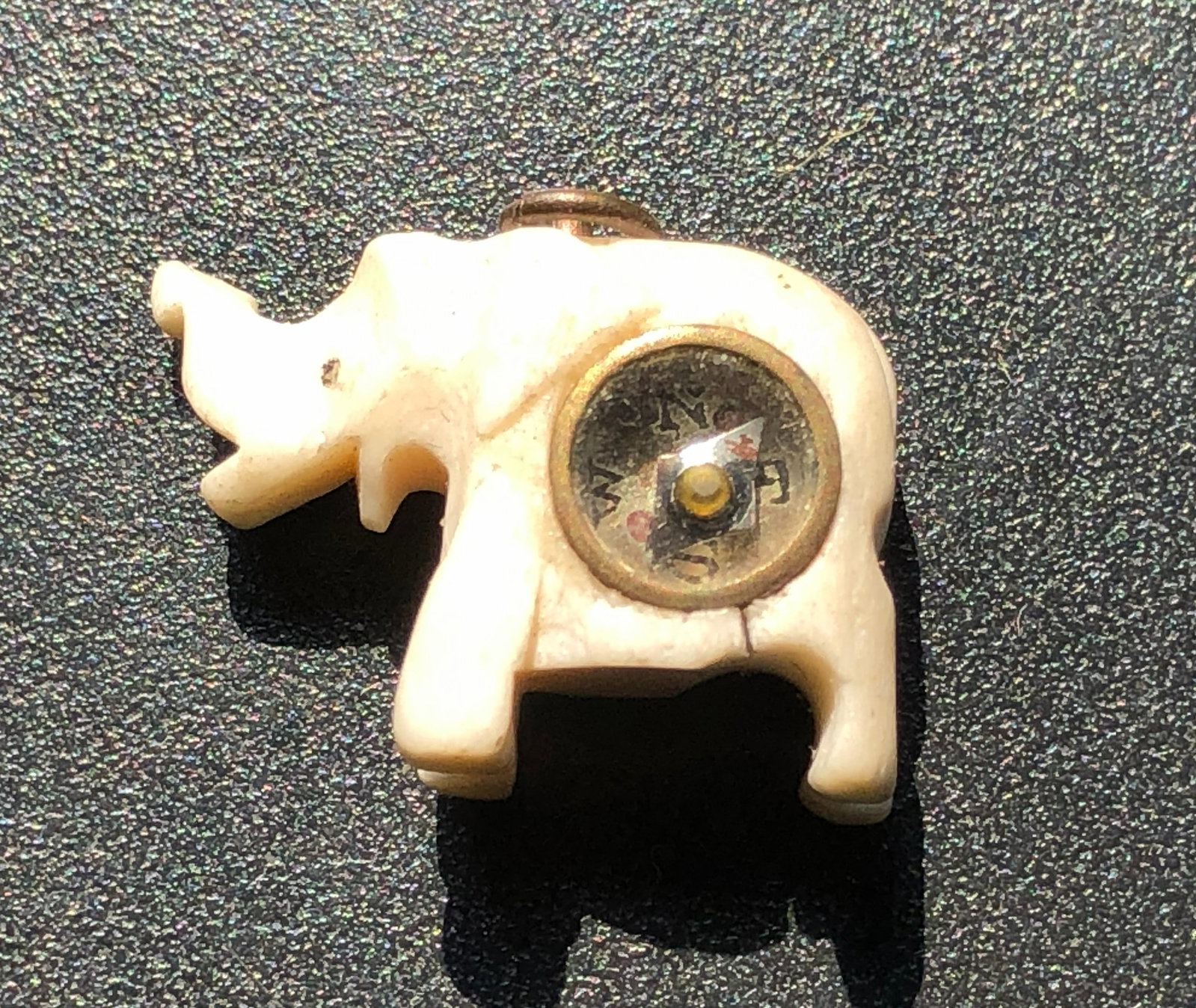 A unique elephant-shaped pendant with a built-in compass. (1 of 3)