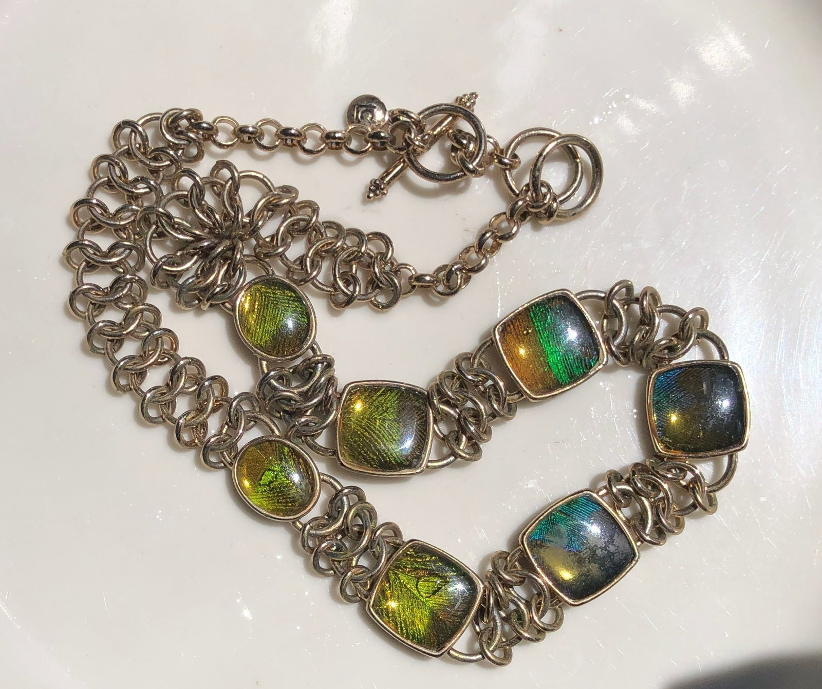 A vibrant chain bracelet featuring colorful square stones: A vibrant chain bracelet featuring colorful square stones