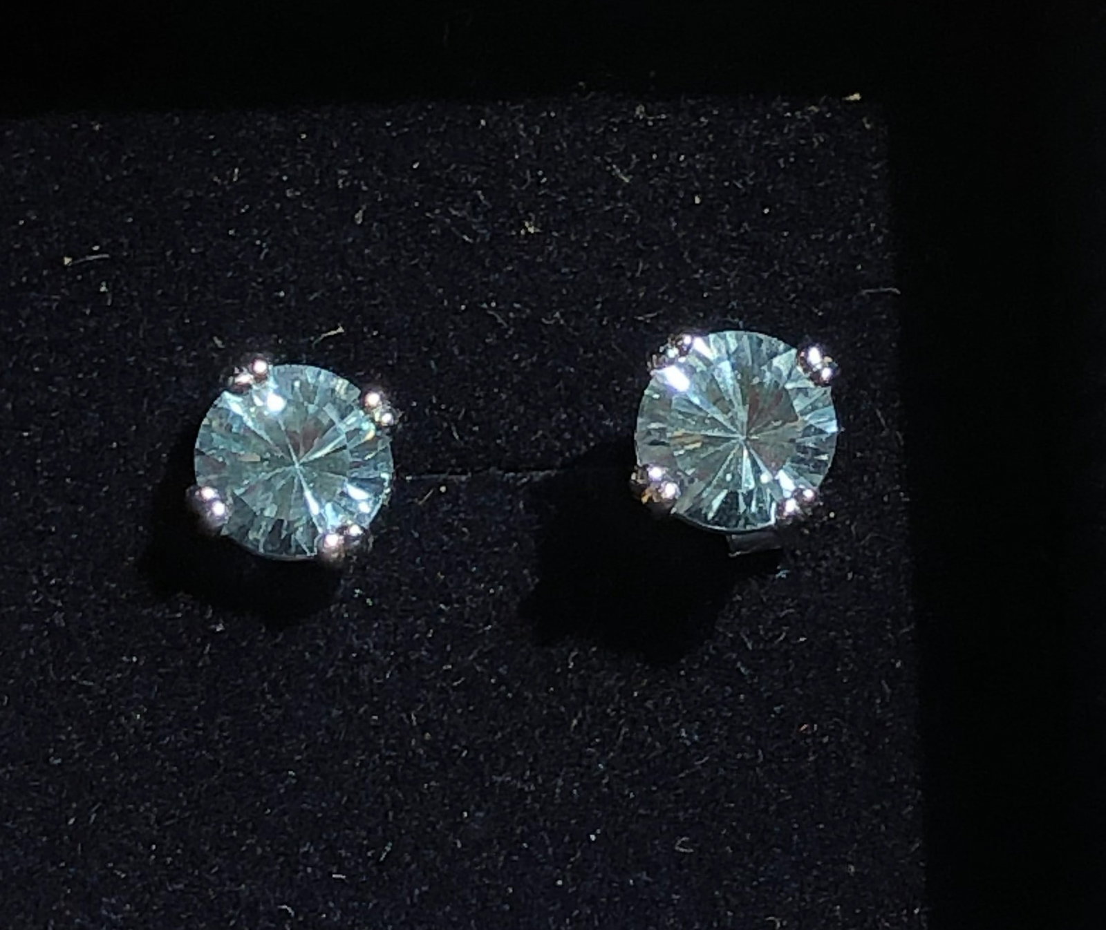 Elegant topaz stud Silver earrings set in a classic four-prong setting: Elegant topaz stud Silver earrings set in a classic four-prong setting