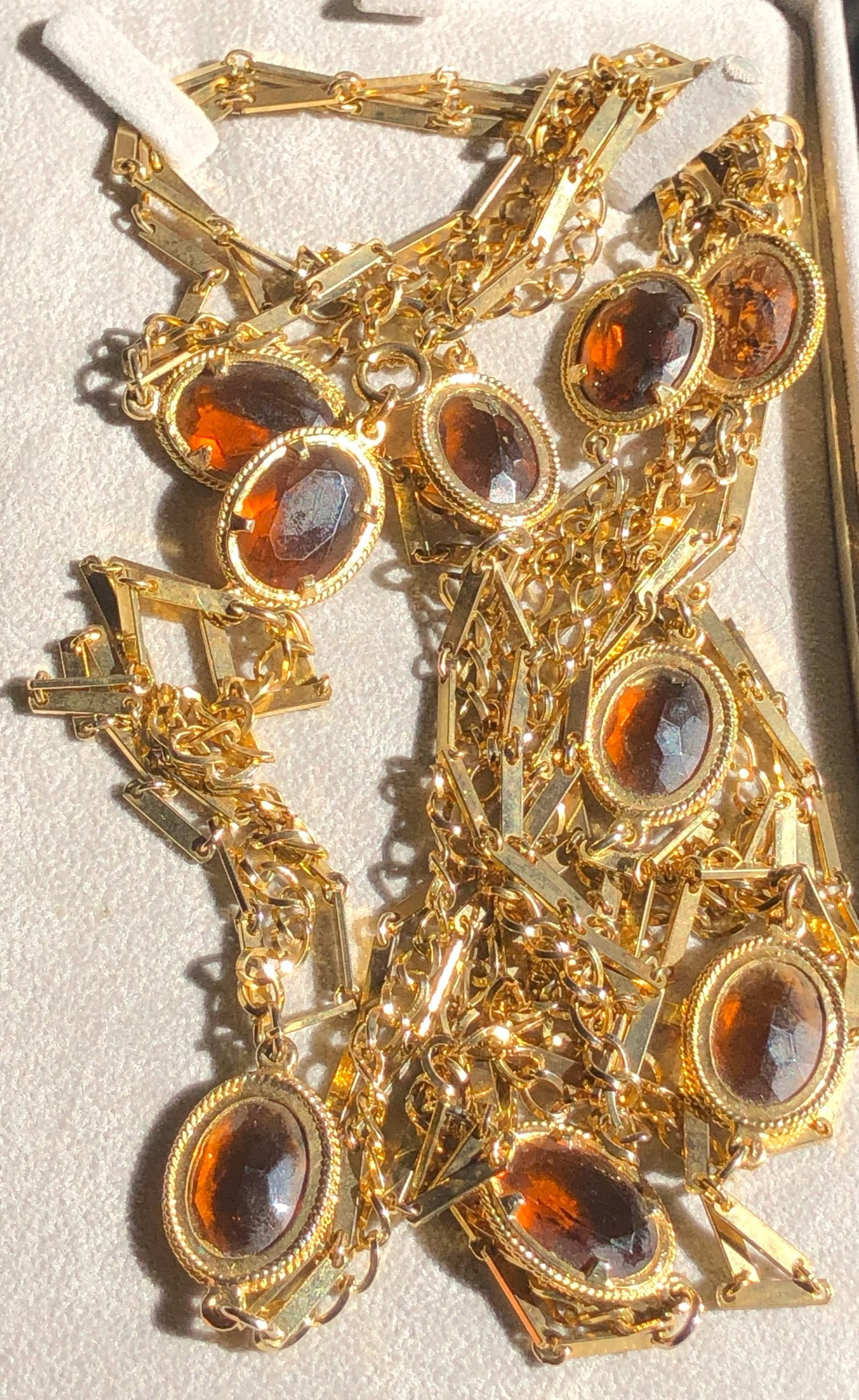 Gold Color Necklace: Elegant gold color necklace with glass stones, perfect for special occasions.
