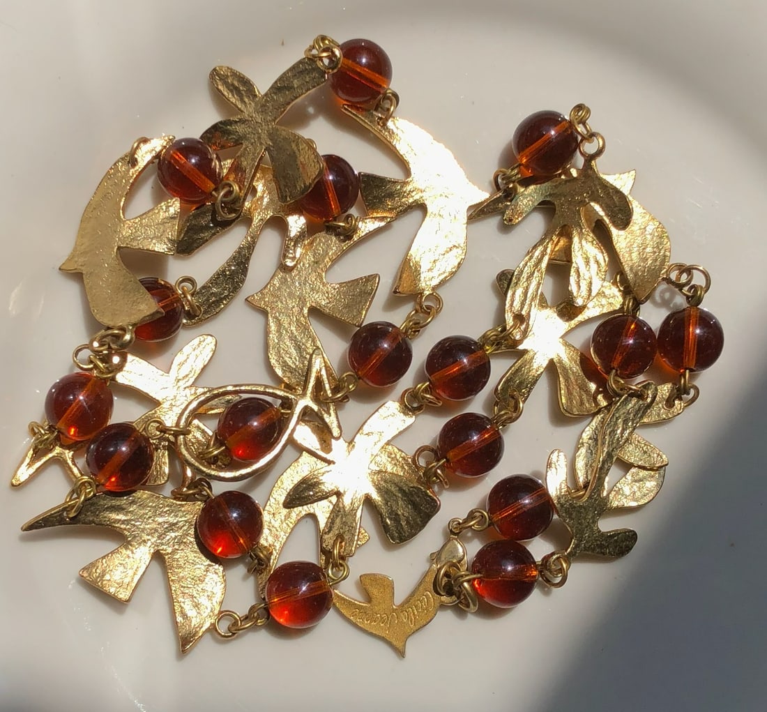Gold Filled and Amber Color Bead Necklace: A stunning necklace featuring gold-toned metal and amber color beads.