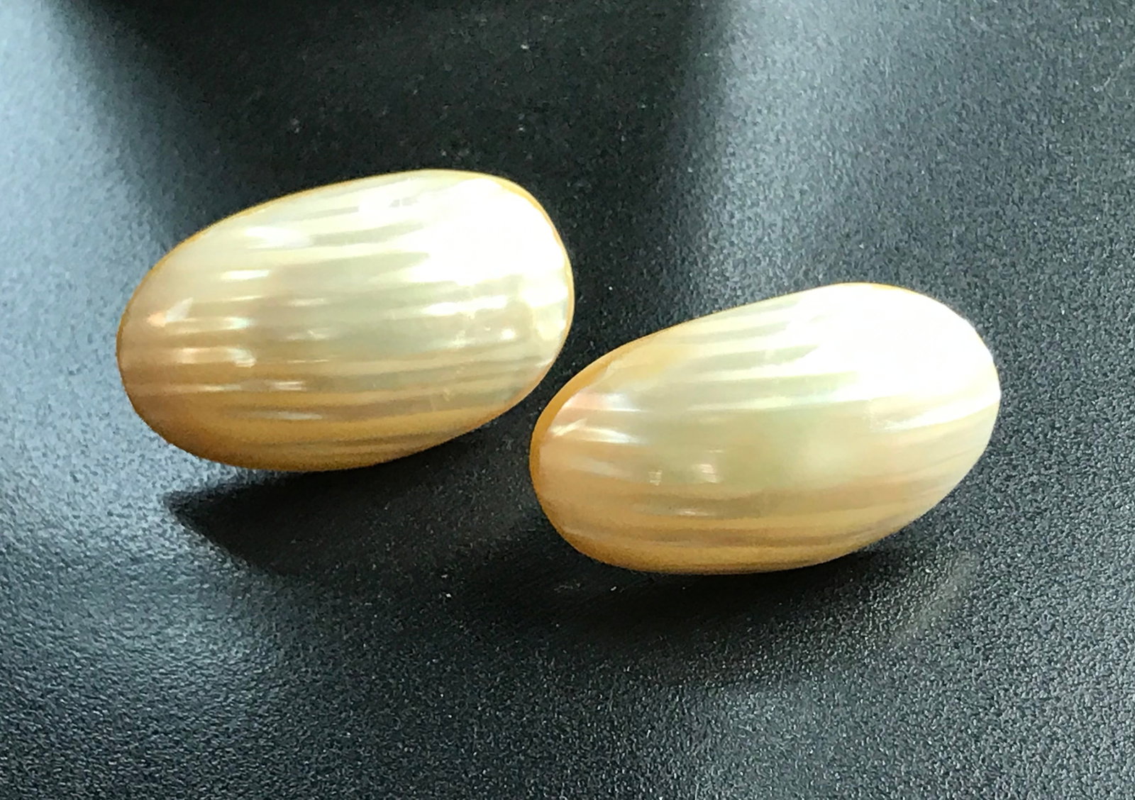 grooved oval dome shaped earings, tannish color (1 of 5)