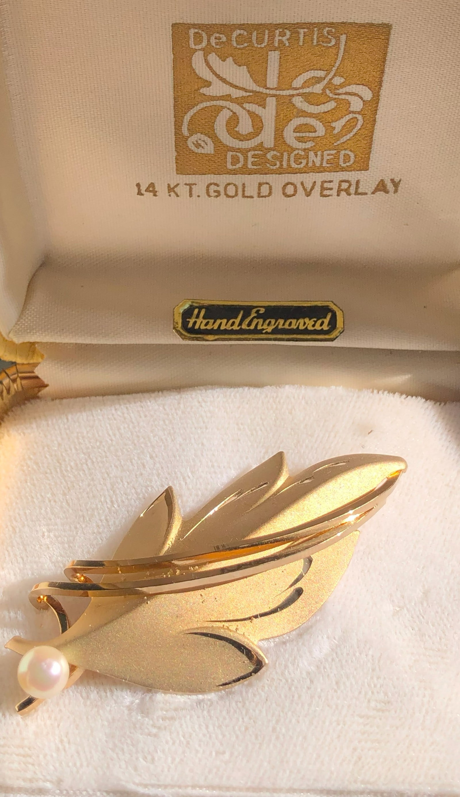 Gold Filled Leaf Brooch: Elegant gold filled leaf brooch with a pearl accent.