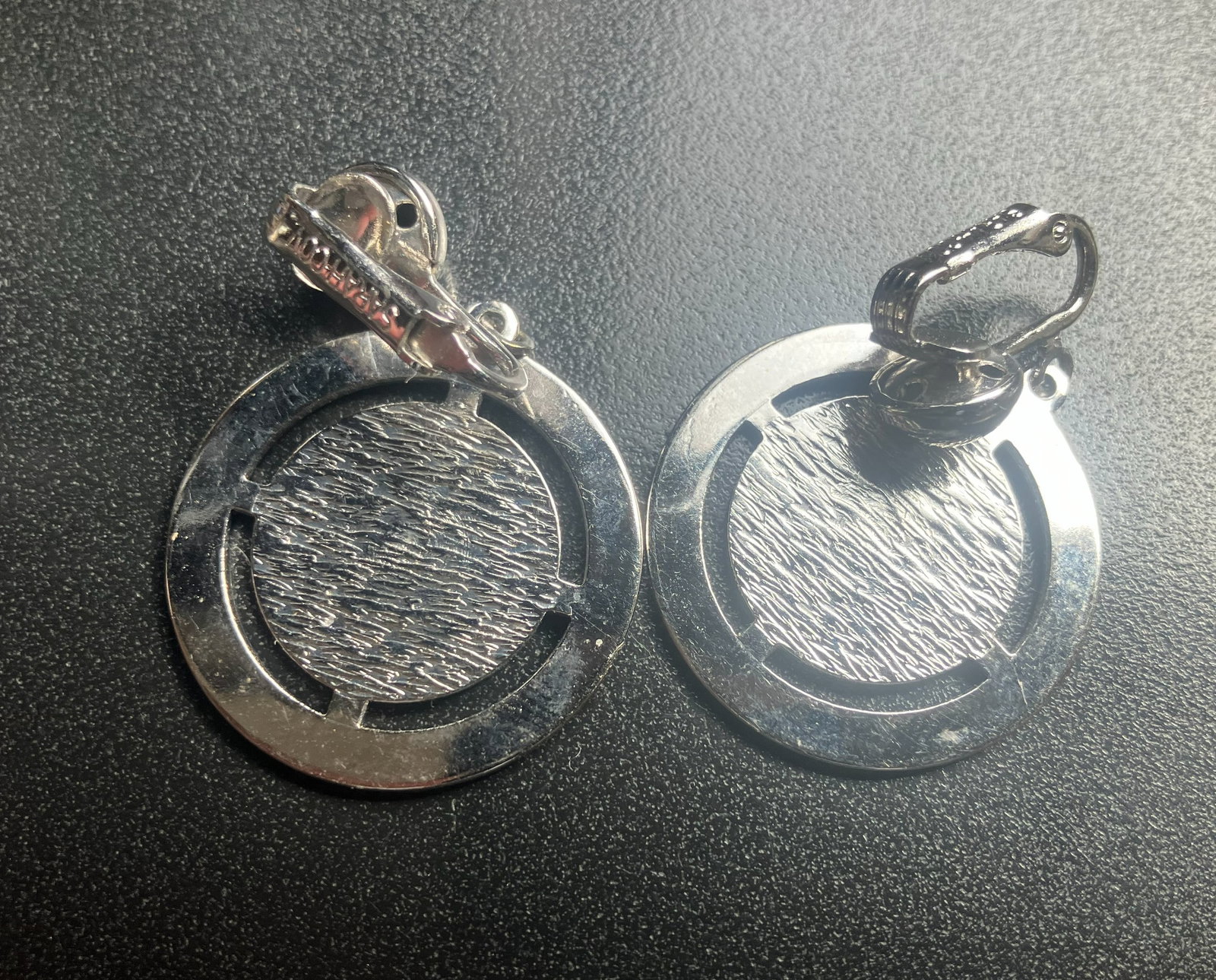 Vintage Earrings: Elegant earrings with a textured design.