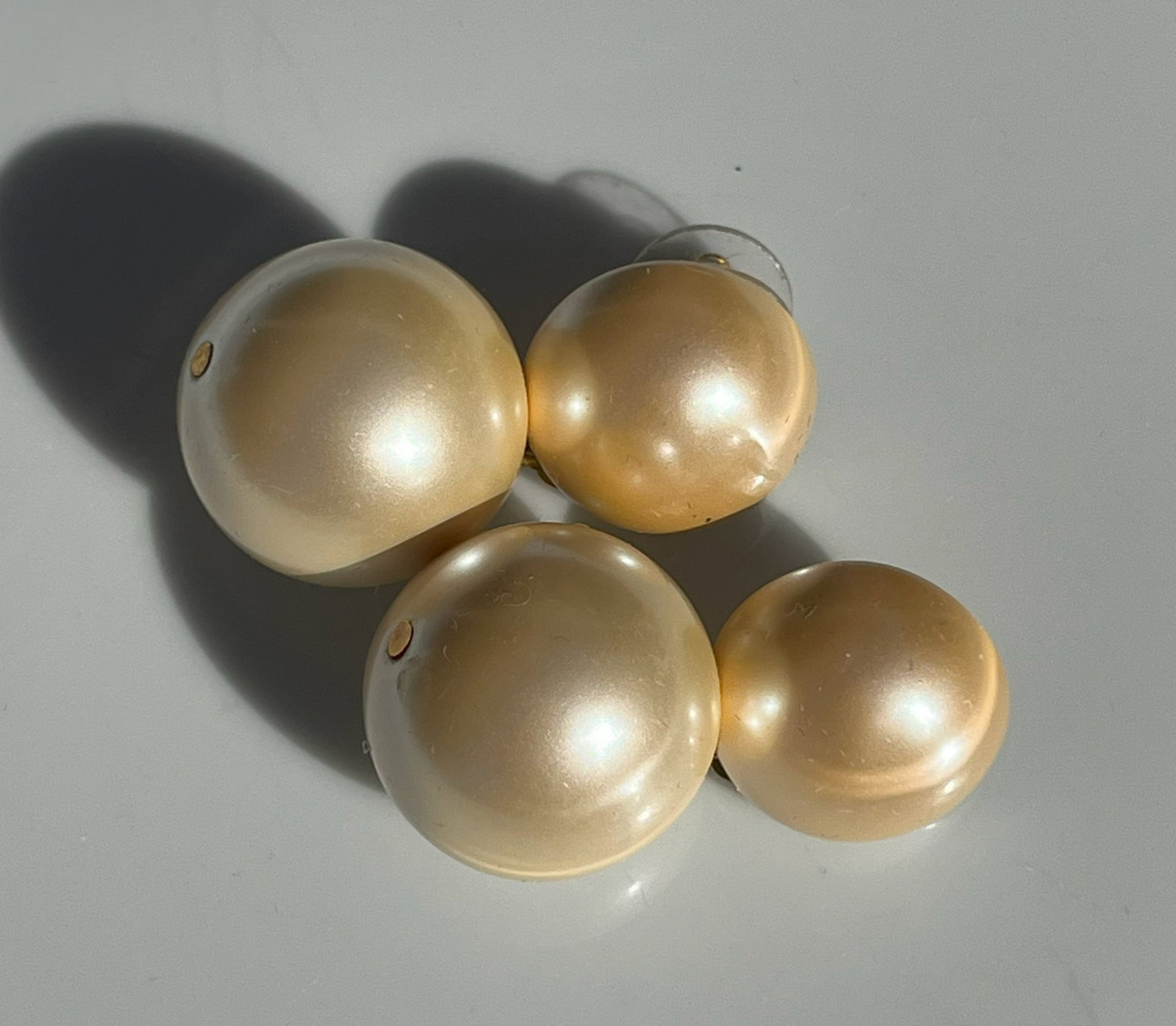 Faux Pearl Earrings: Elegant Faux pearl earrings with a classic design.
