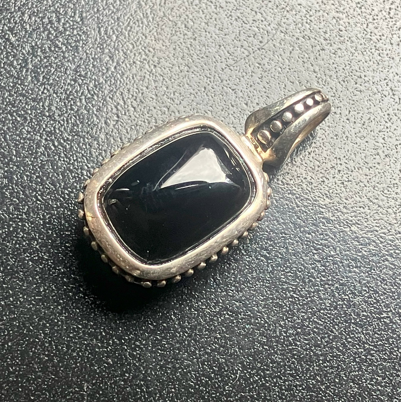Black Stone Silver Pendant: Elegant black stone pendant with a detailed silver setting, Size: 1".