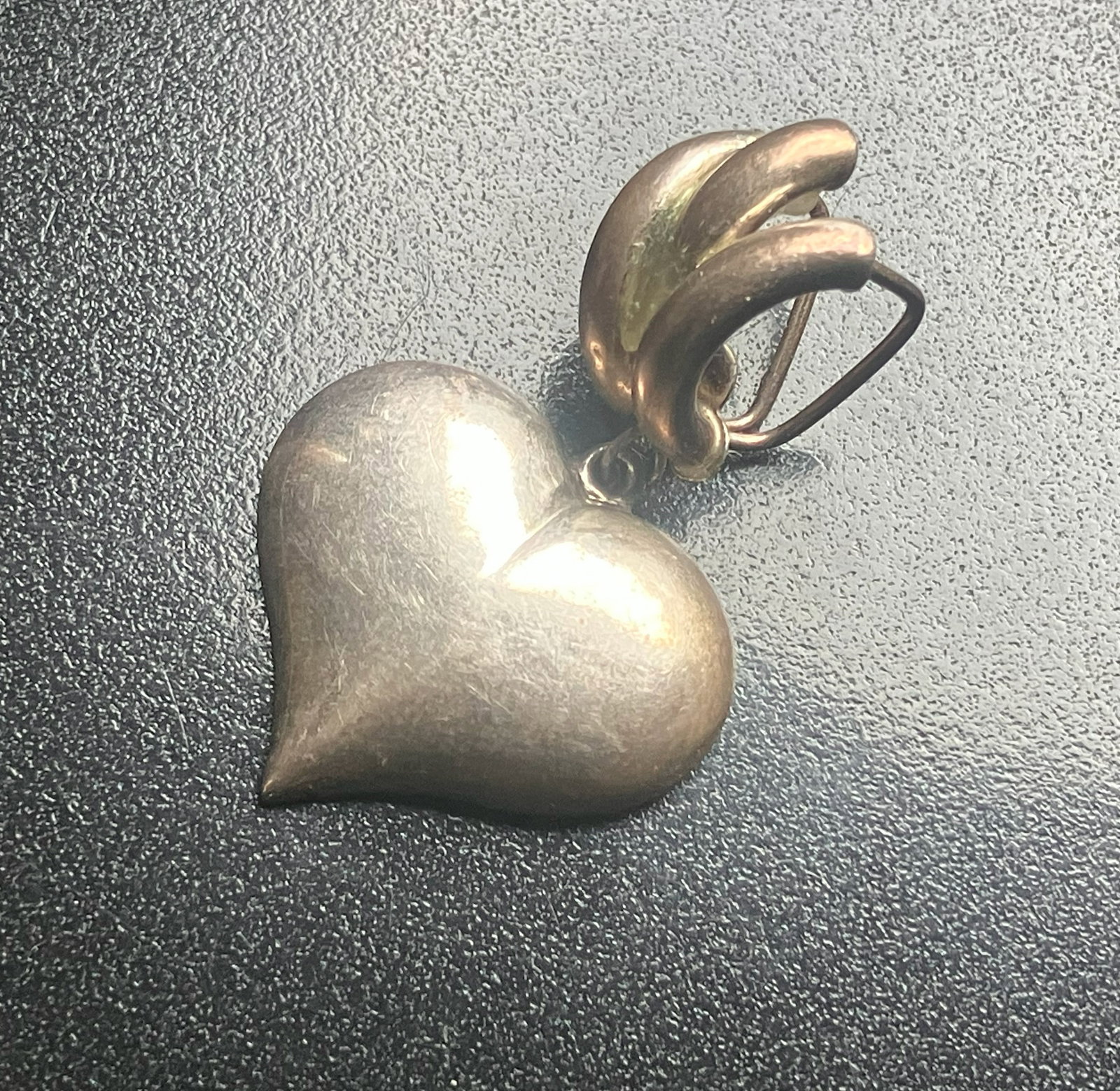 Silver Heart Pendant: A beautiful heart-shaped Silver pendant with a unique clasp design.