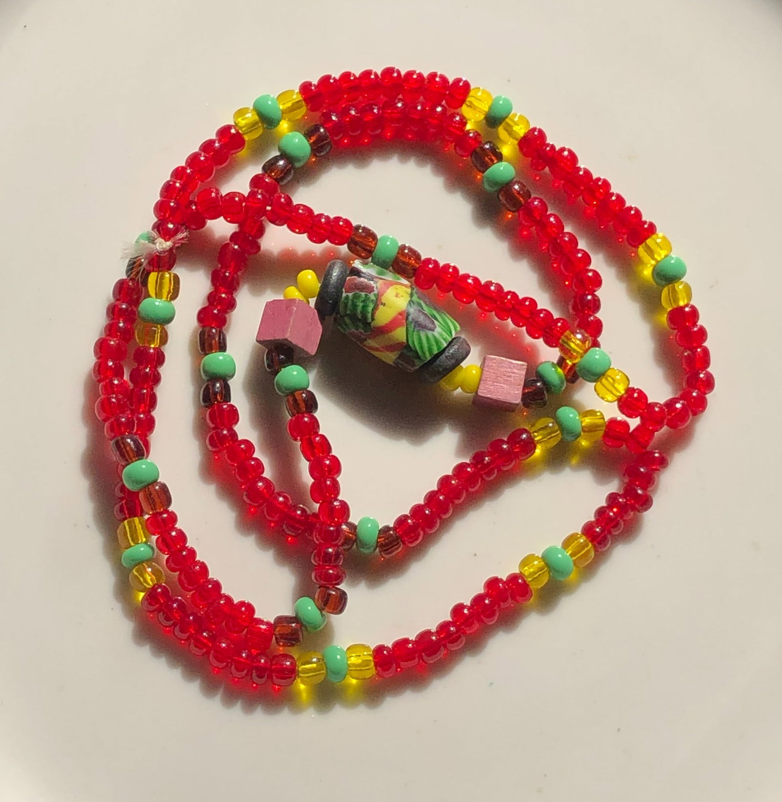 Colorful Beaded Necklace: A vibrant necklace made with colorful beads, perfect for adding a pop of color to any outfit.