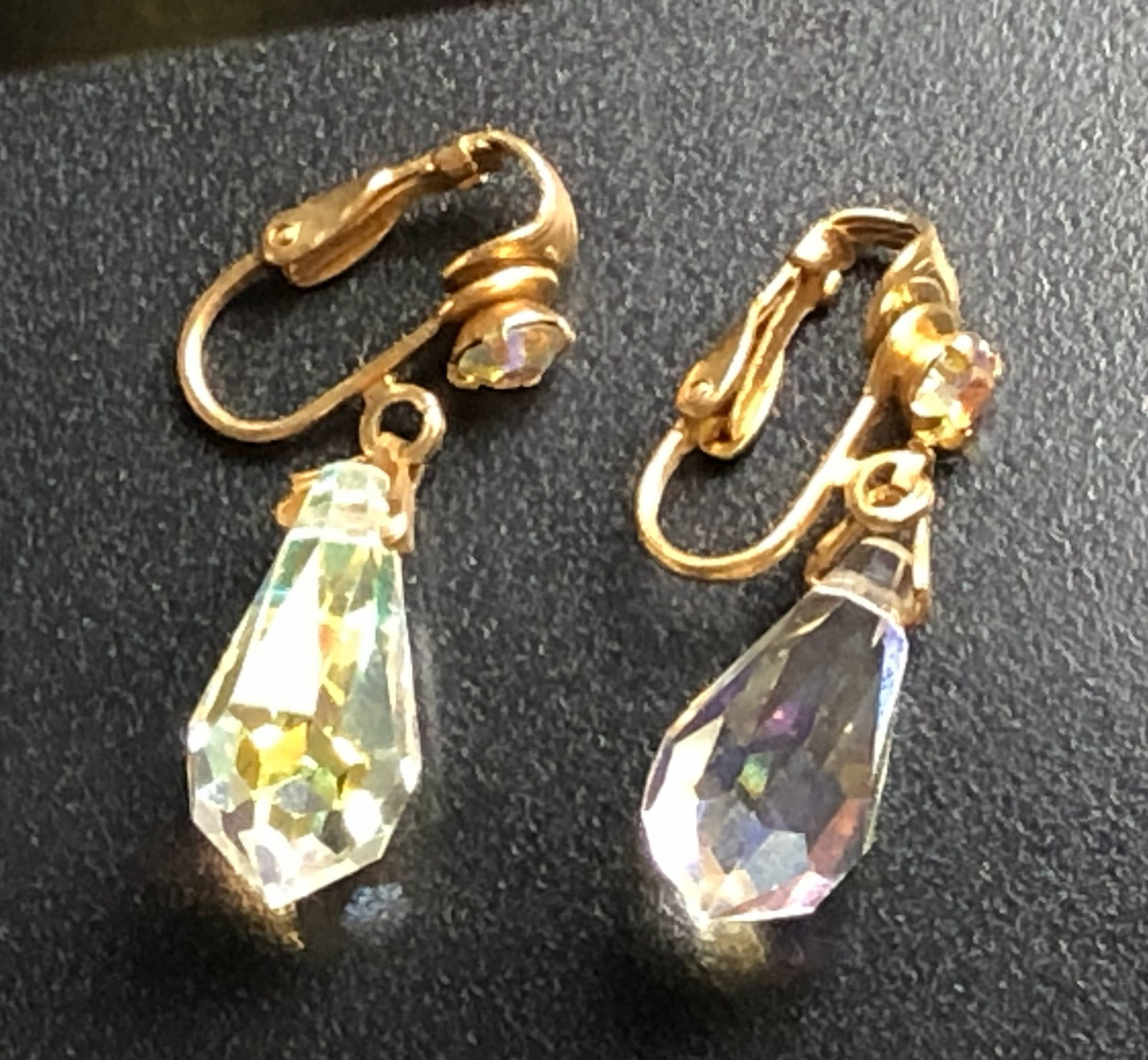 Crystal Drop Earrings: Elegant crystal drop earrings with gold-tone clip-on backs.