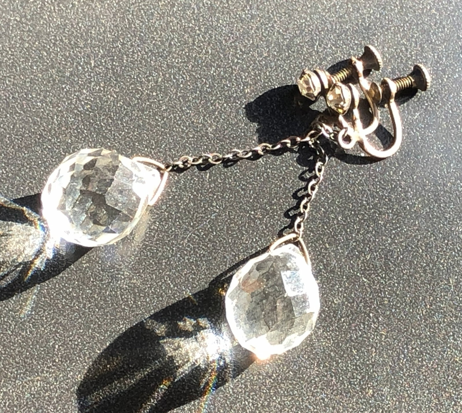Crystal Drop Earrings: Elegant crystal drop earrings with a screw-back design.