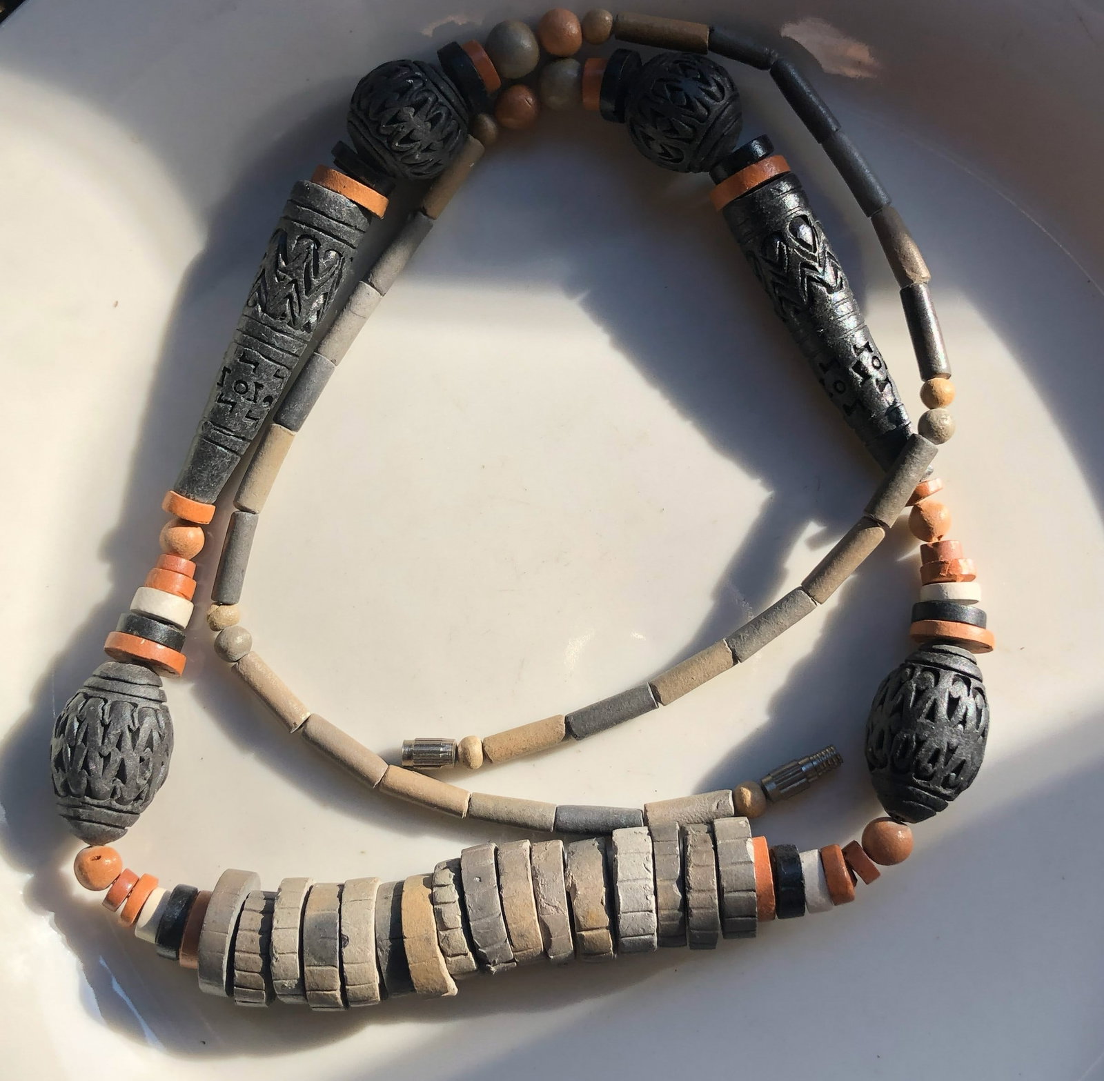 Handcrafted Beaded Necklace: A unique handcrafted beaded necklace with intricate designs and earthy tones.