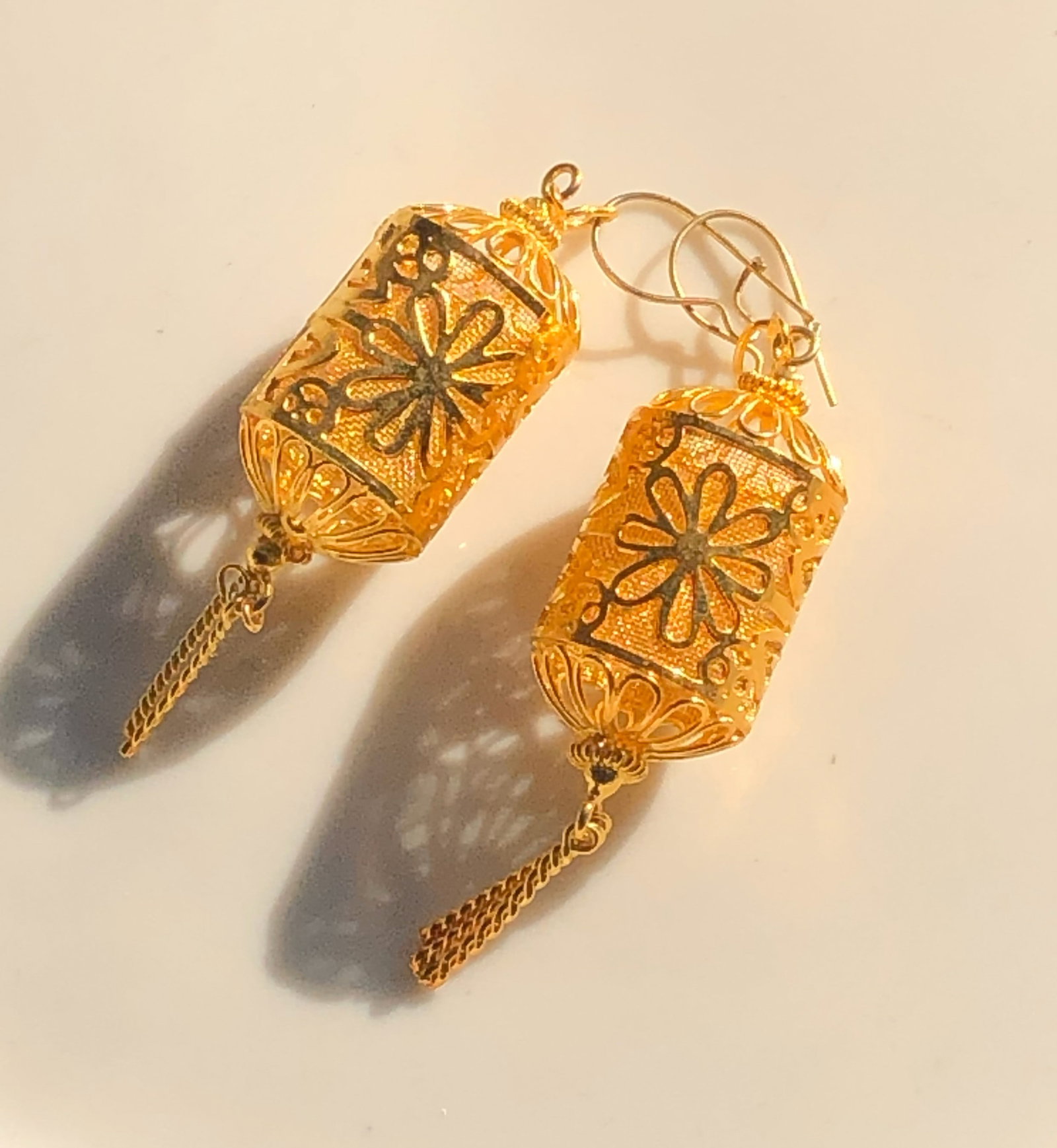 Gold Color Filigree Earrings: Elegant gold color filigree earrings with intricate floral design.