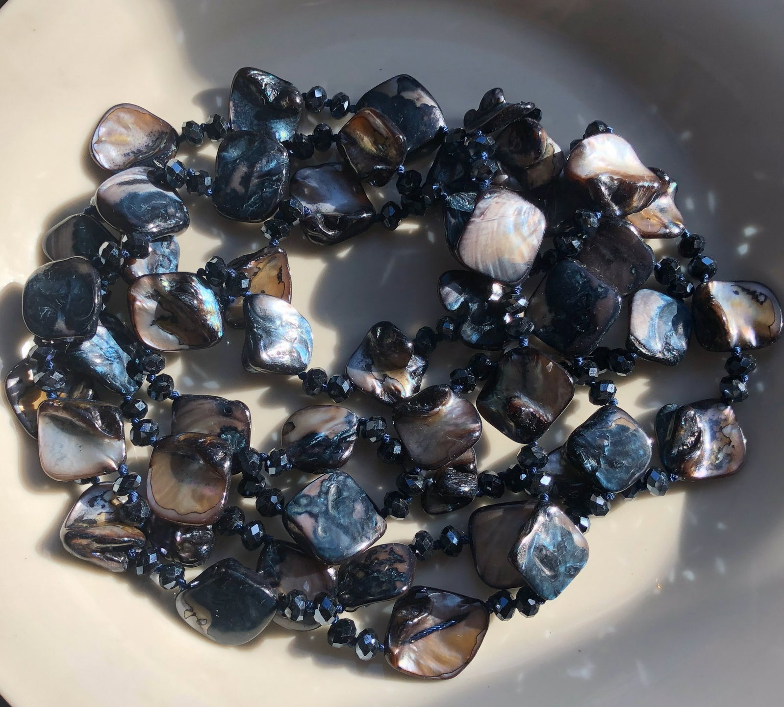 Black Pearl Necklace: Elegant black pearl necklace with a unique design.