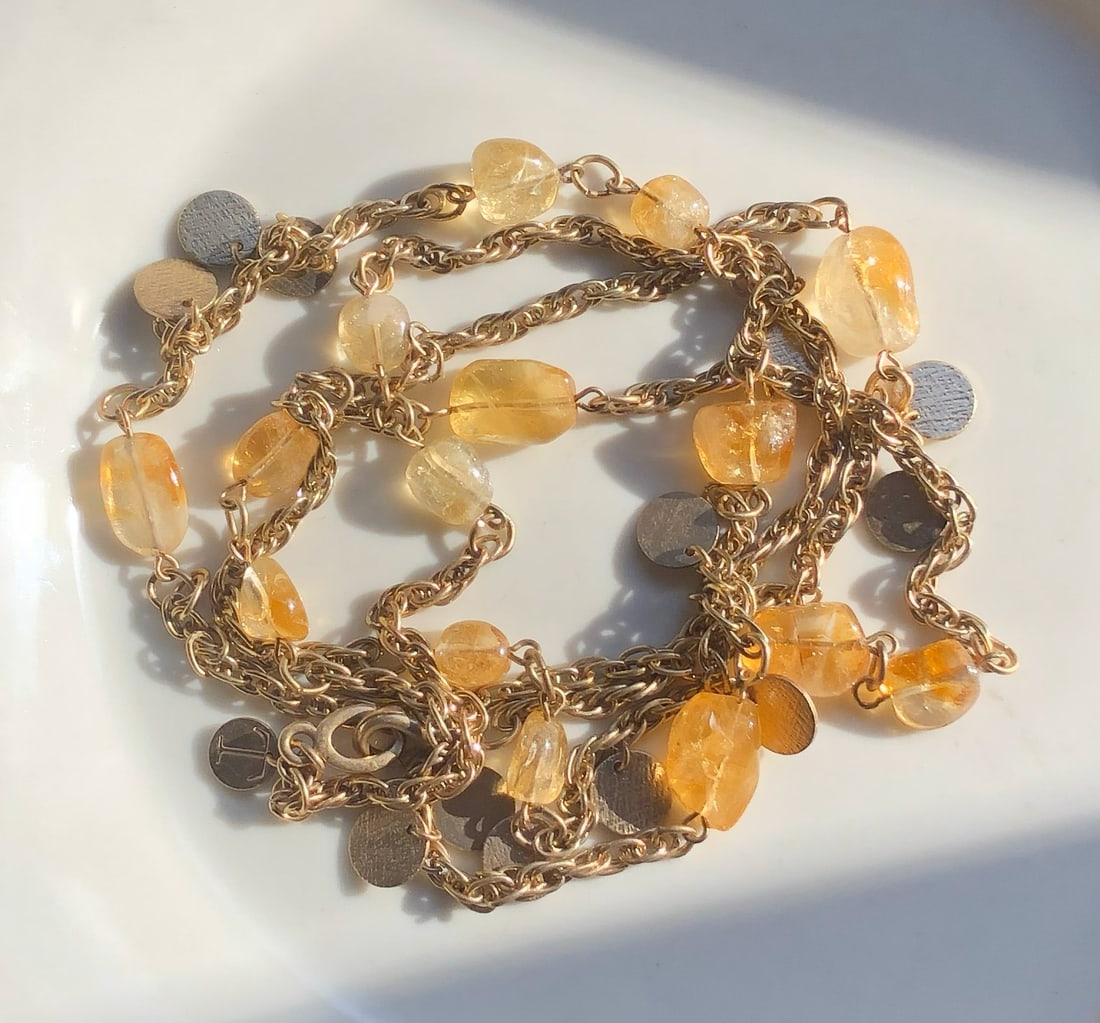Citrine Gemstone Necklace: A beautiful citrine gemstone necklace with gold chain.