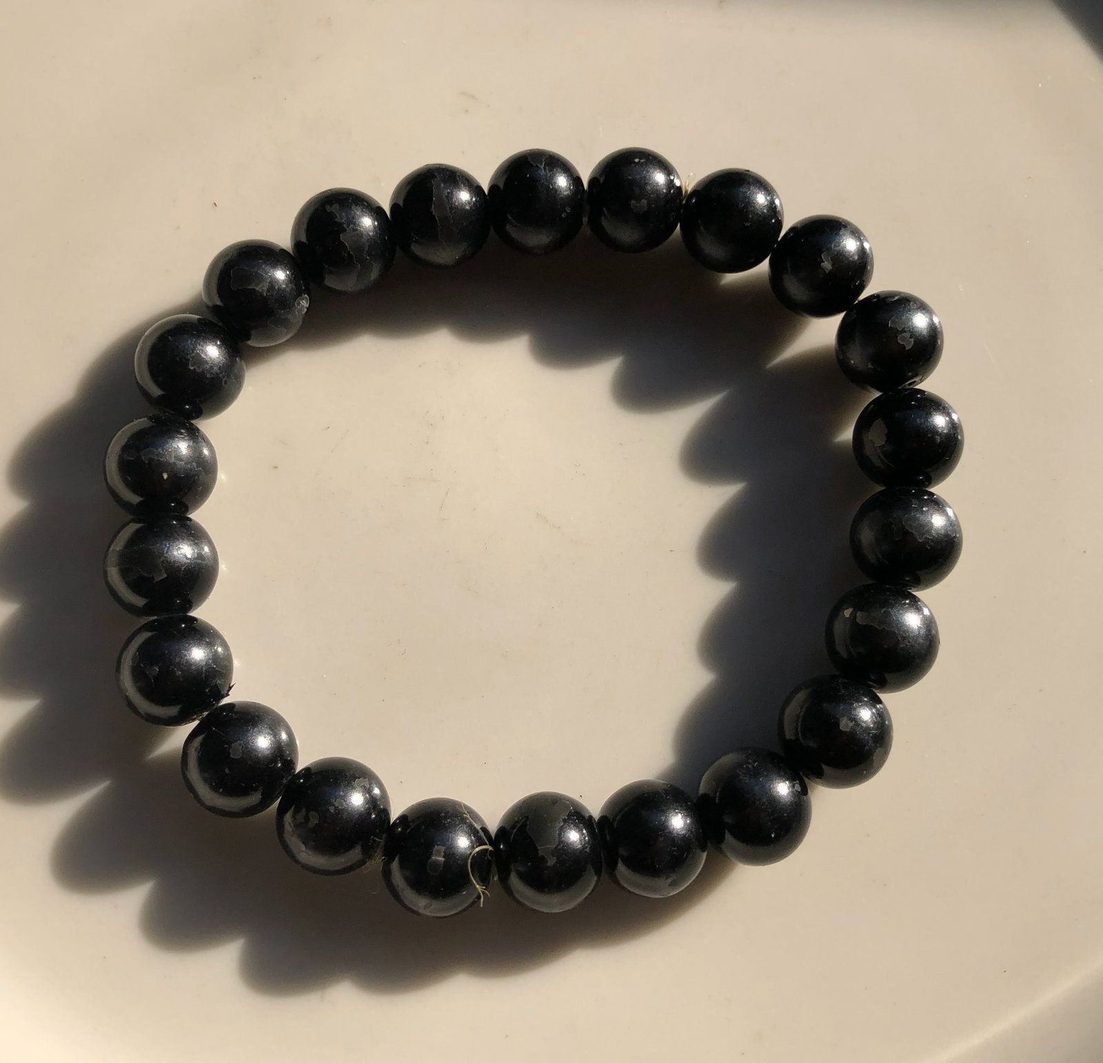 Black Pearl Bead Bracelet: A stylish black pearl bead bracelet perfect for any occasion.