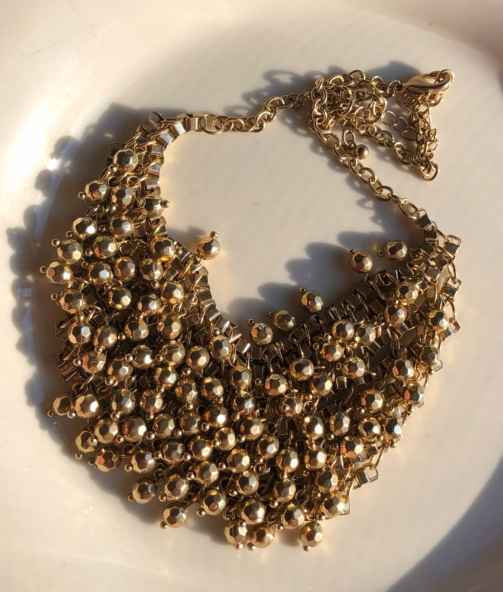 Gold Color Statement Necklace: A stunning gold Color statement necklace with intricate detailing.