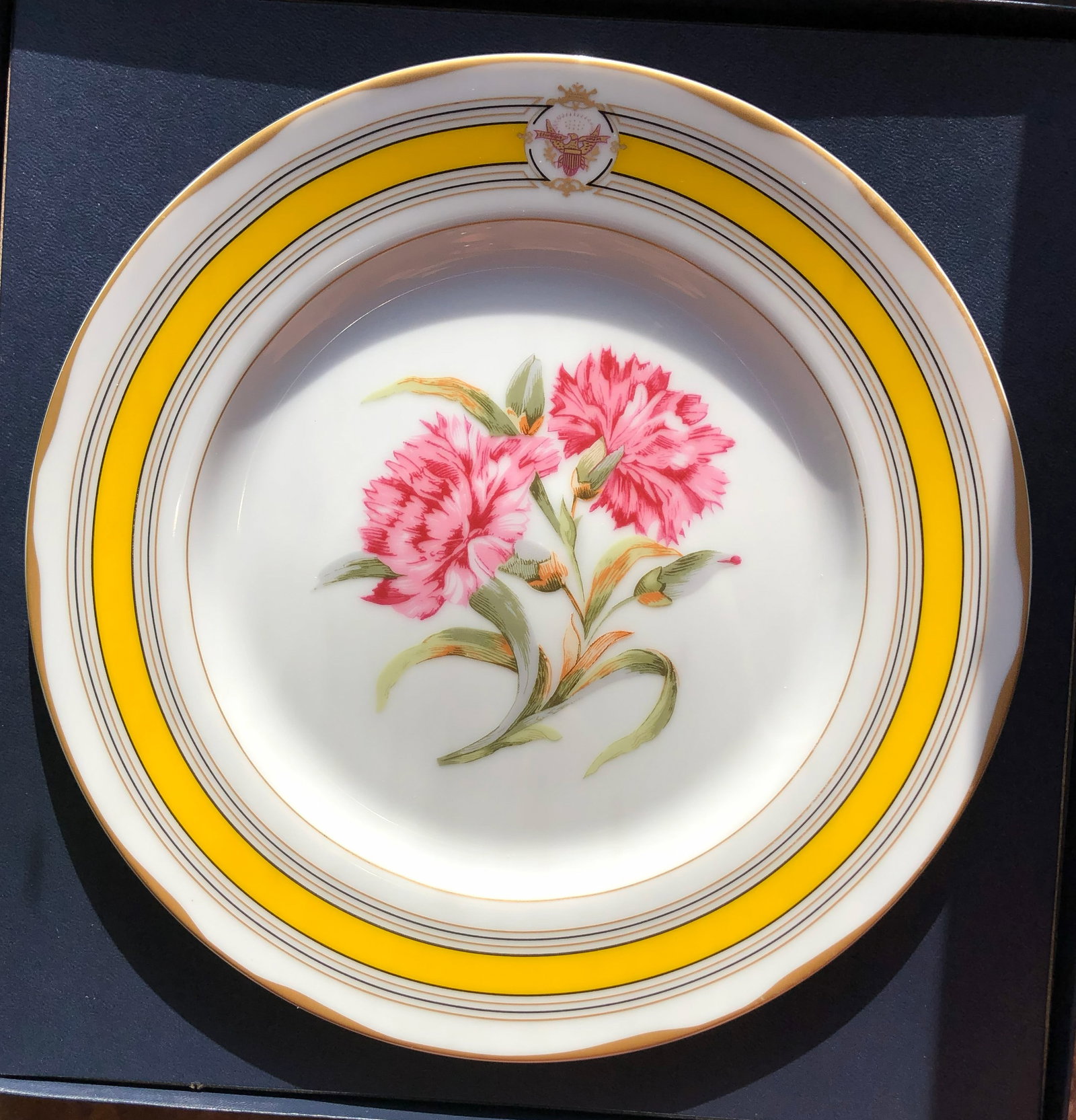 White house Desert Plate: A beautifully designed Whitehouse decorative plate with floral patterns and gold accents.