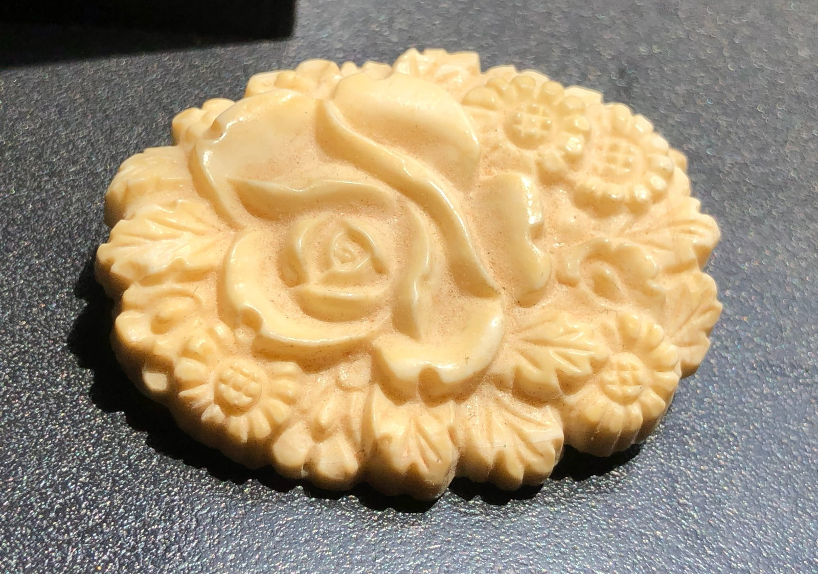 A beautifully carved soap featuring intricate floral designs (1 of 3)