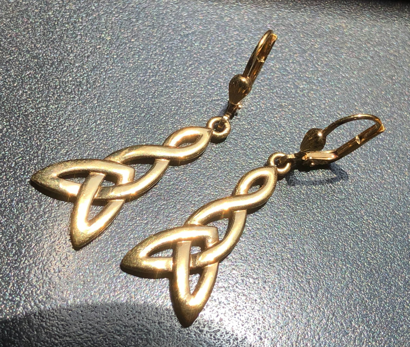 Elegant gold color earrings featuring a Celtic knot design (1 of 2)