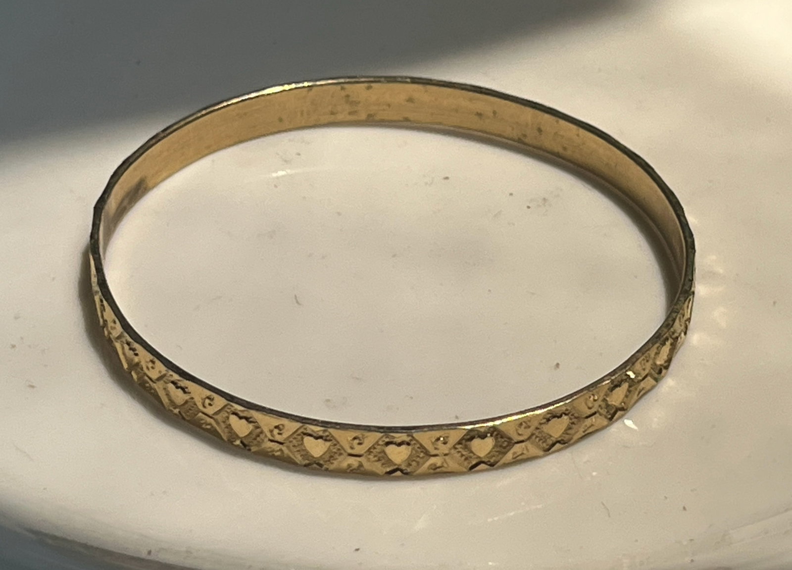 A beautifully crafted gold Filled bangle bracelet with heart patterns: A beautifully crafted gold Filled bangle bracelet with heart patterns