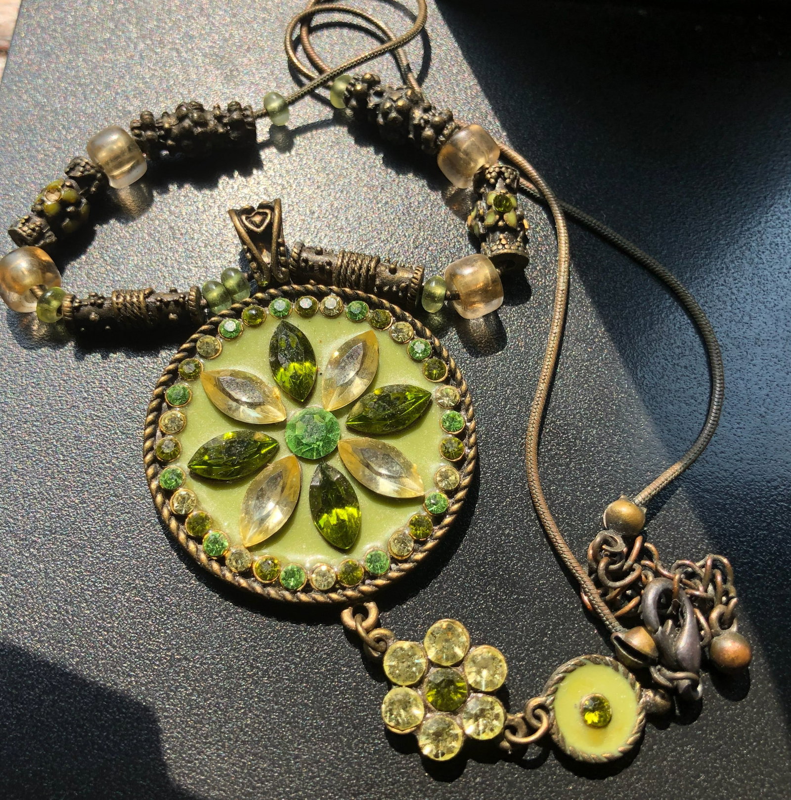 A beautifully crafted vintage necklace featuring green gemstones and intricate beadwork (1 of 3)