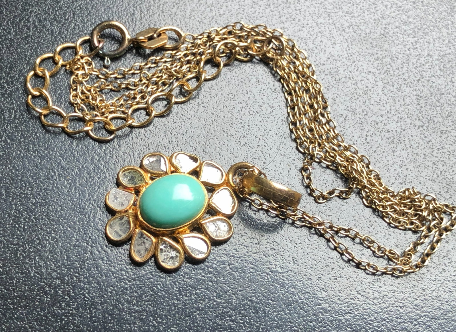A beautiful gold filled chain necklace featuring a turquoise pendant with a floral design: A beautiful gold filled chain necklace featuring a turquoise pendant with a floral design