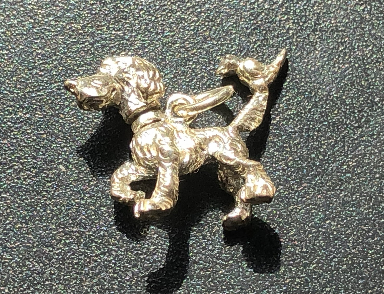 Silver Poodle Dog Charm: A beautifully crafted silver poodle dog charm, perfect for pet lovers.