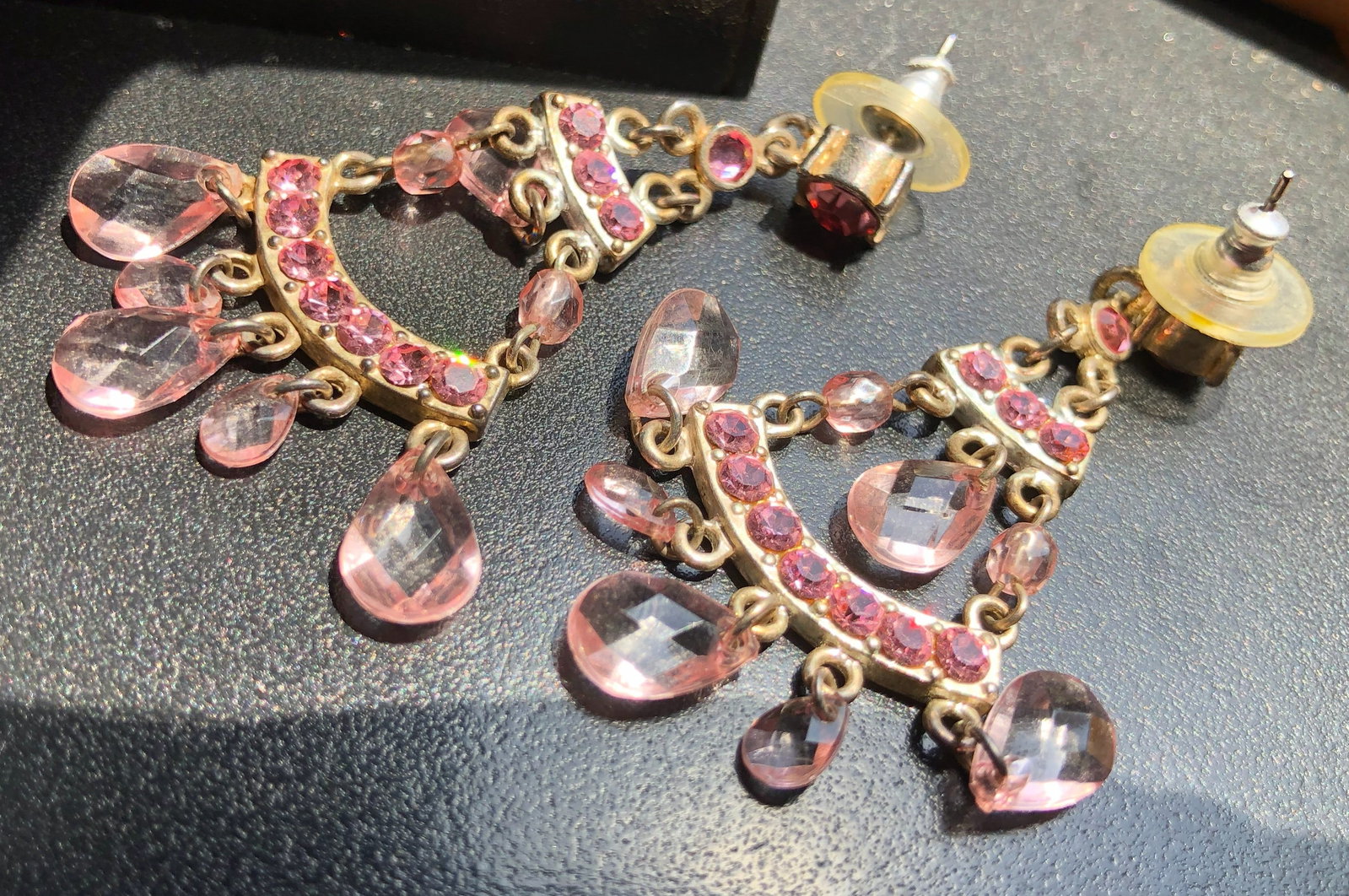 Pink Gemstone Earrings: Elegant earrings adorned with pink gemstones, perfect for special occasions