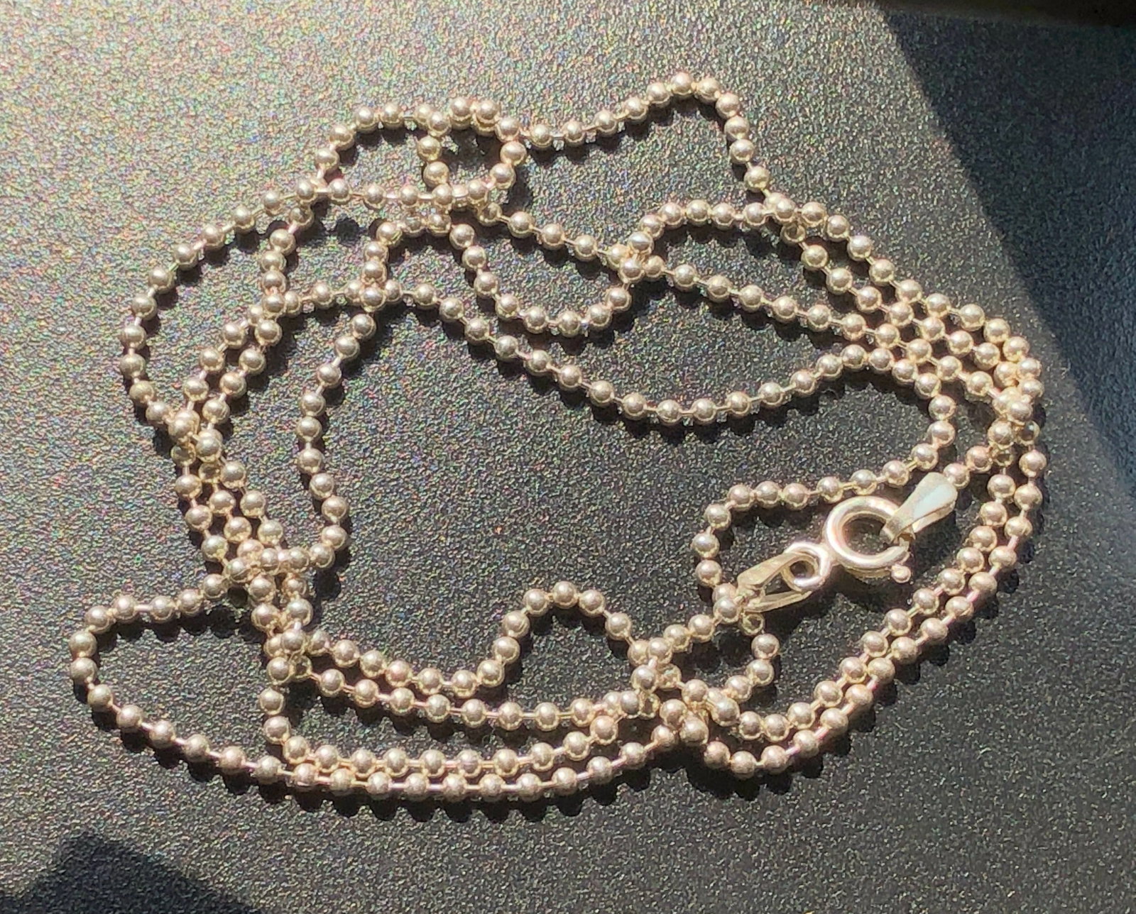 Elegant silver bead necklace with a secure clasp