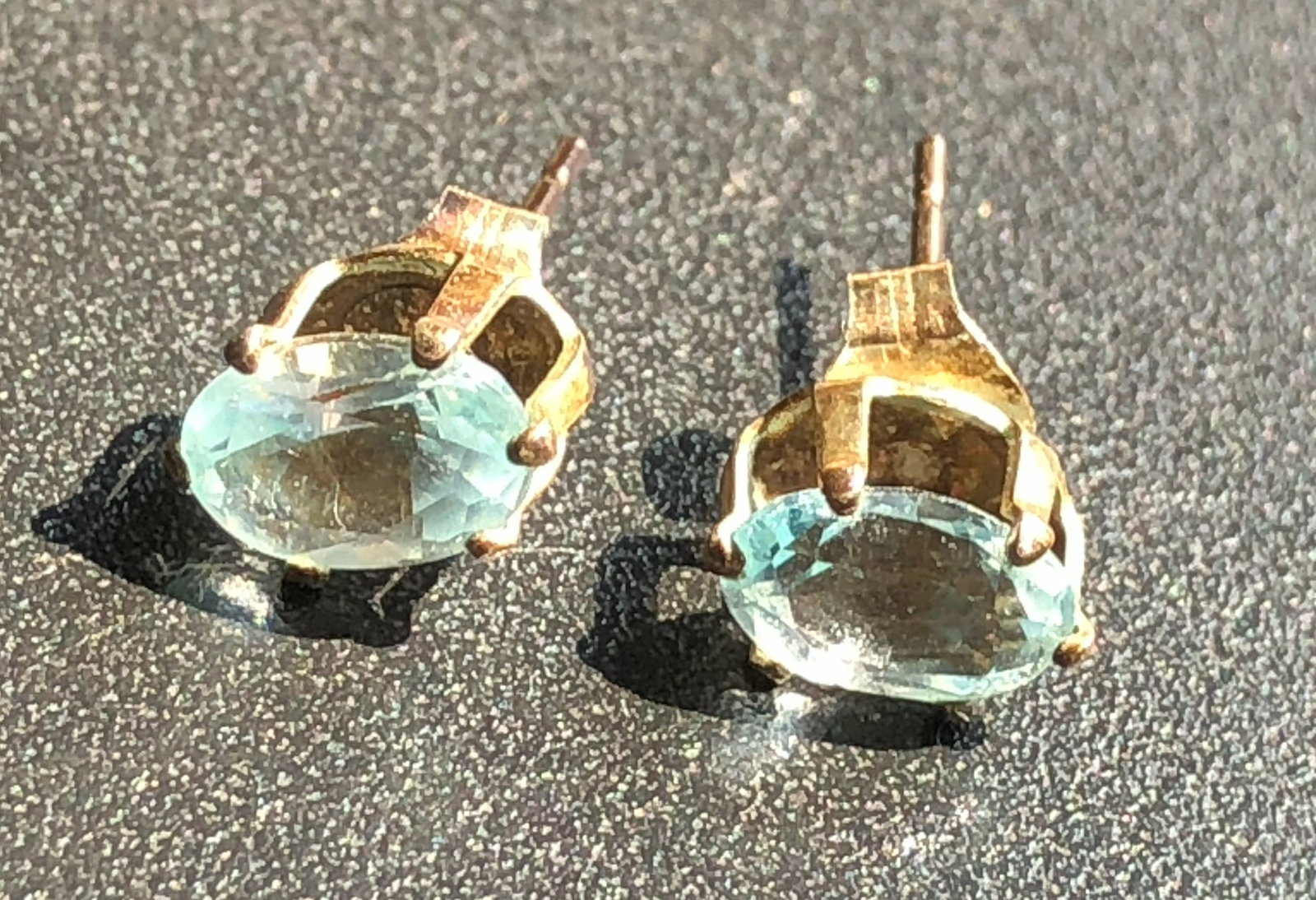 Elegant gold plated earrings featuring aquamarine gemstones
