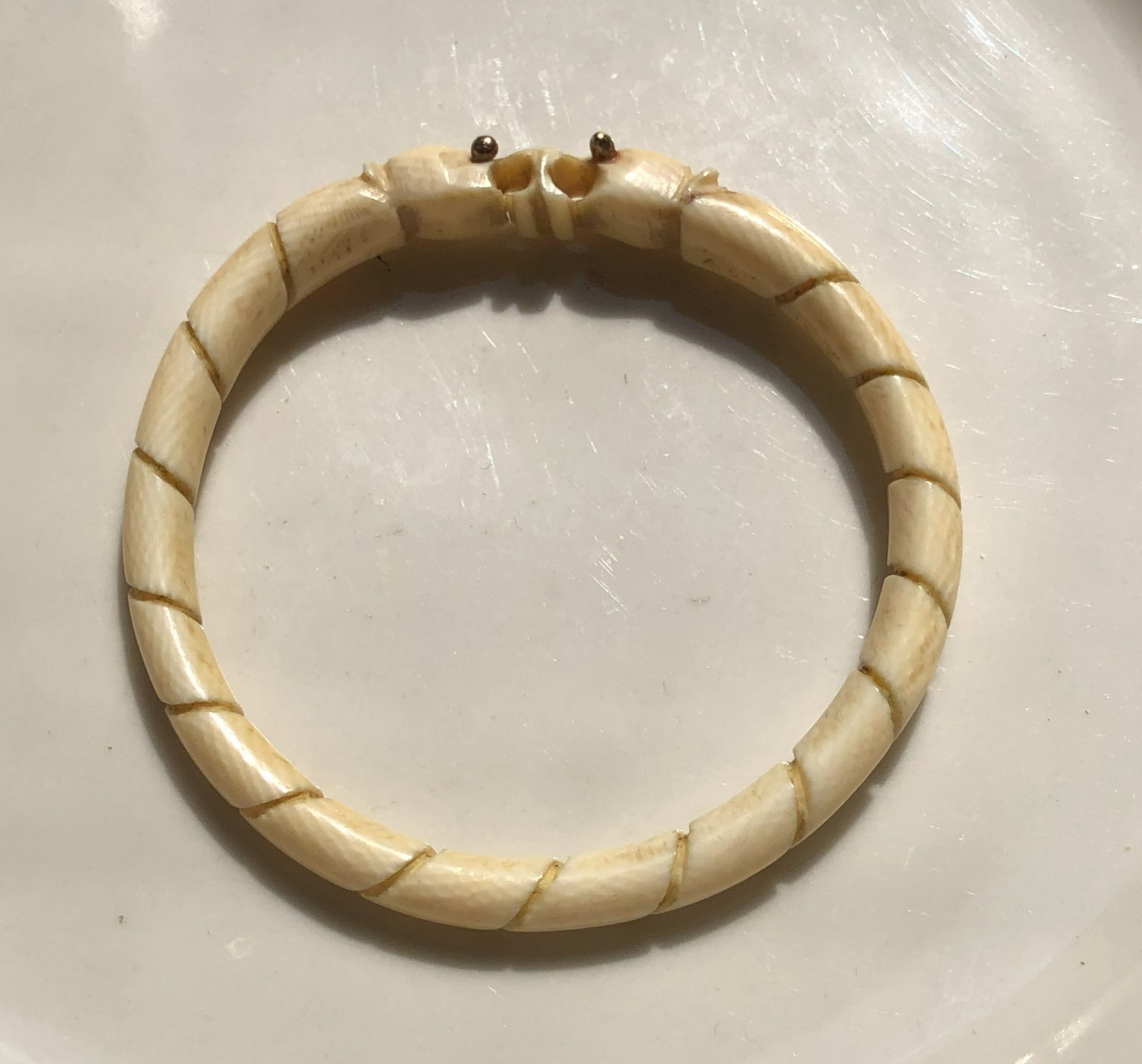 Vintage Carved Bracelet with 114K Gold Eyes: Vintage Carved Bracelet with 114K Gold Eyes, Inner diameter: 2.3"