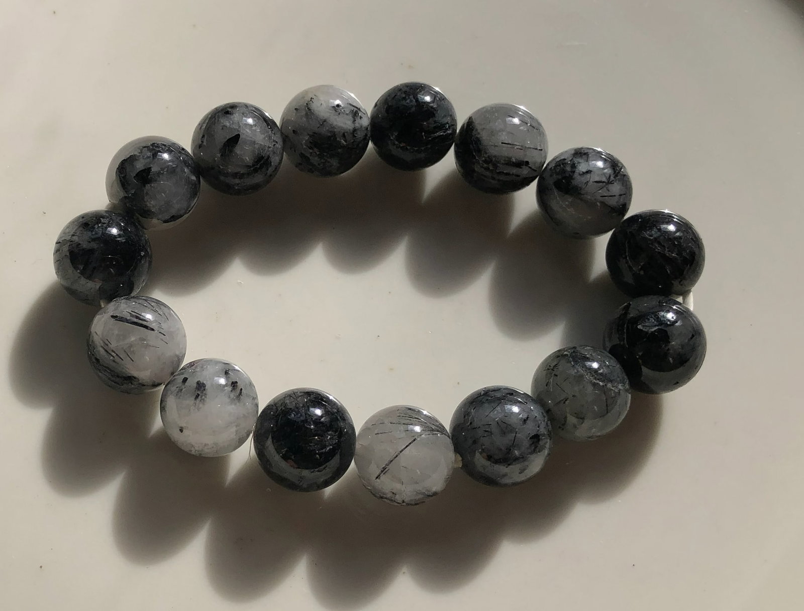 Black and White Beaded Bracelet: A stylish black and white beaded bracelet, perfect for any occasion.