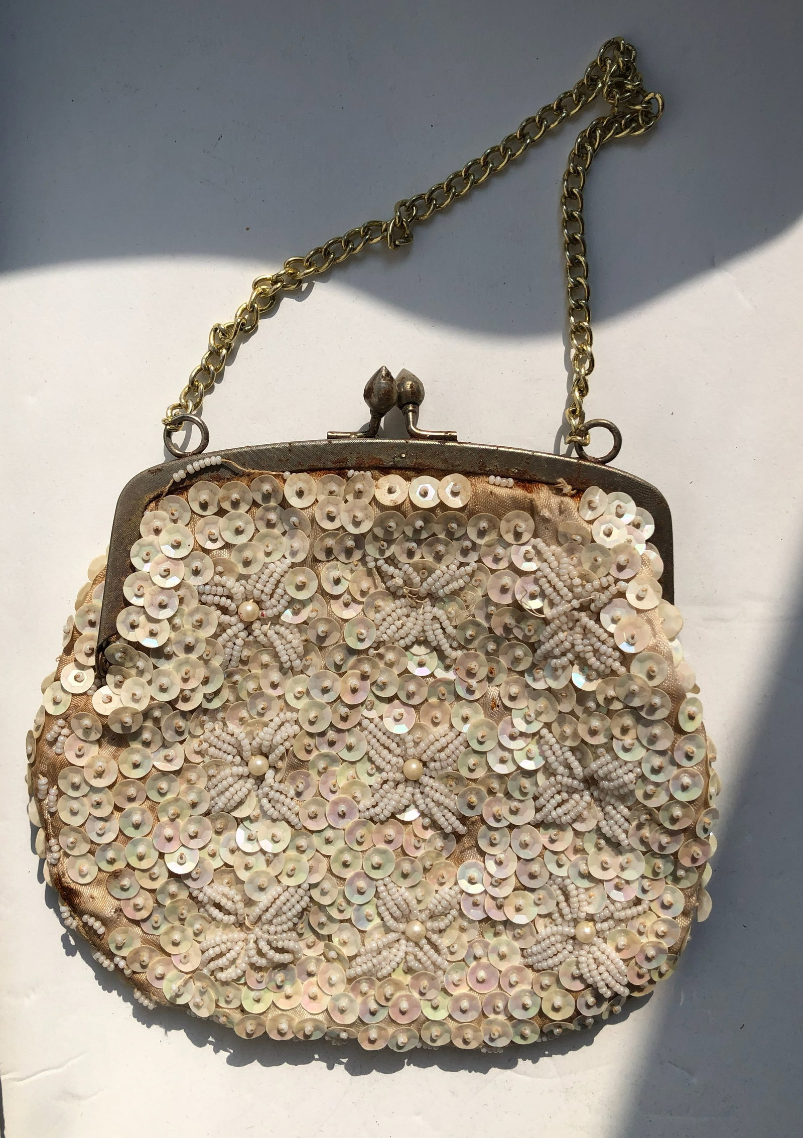 Sequin Beaded Clutch: A stylish clutch adorned with sequins and beads, perfect for evening events.