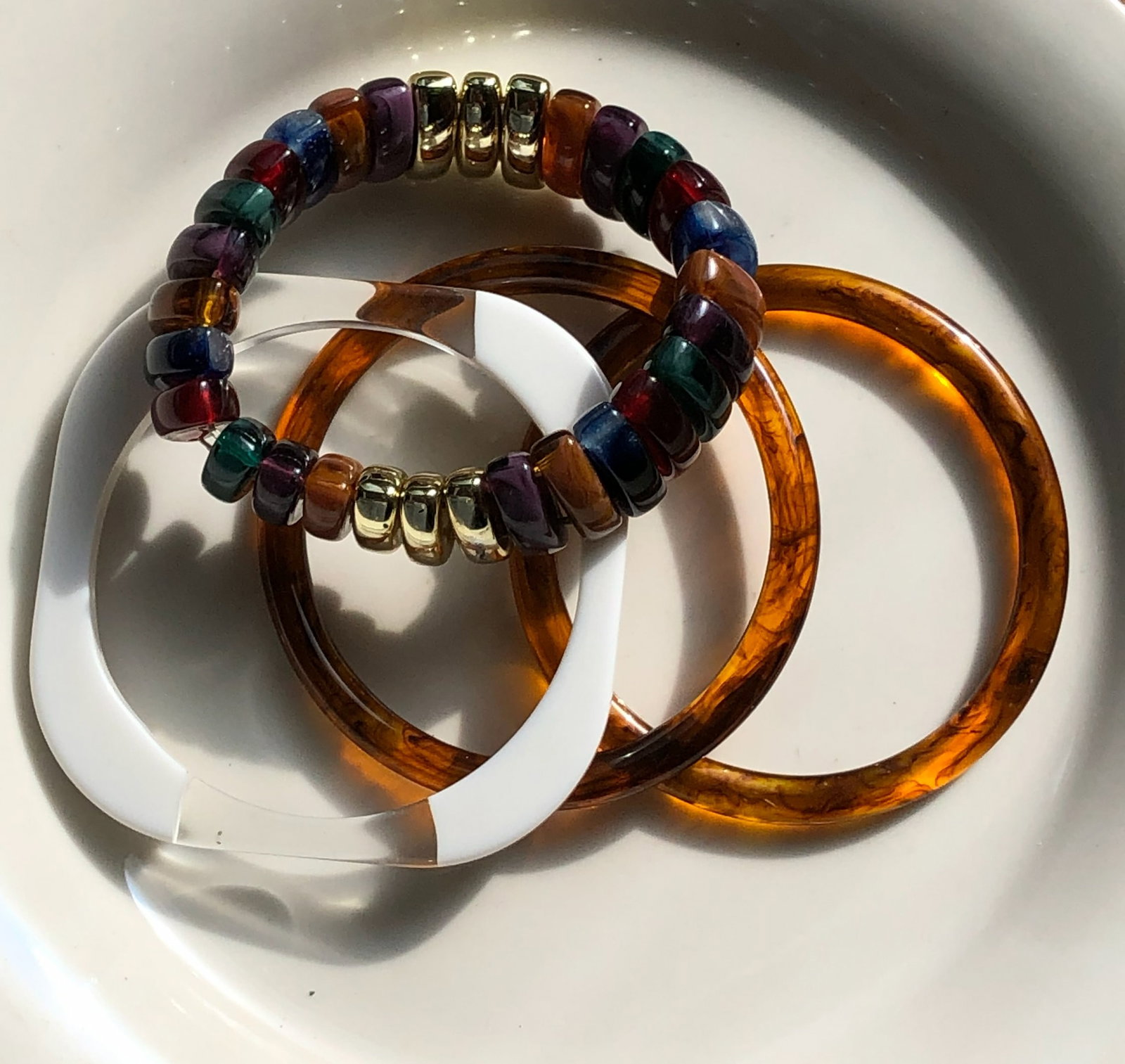 Colorful Beaded Bracelets Set: A set of colorful beaded bracelets with a mix of vibrant and earthy tones.