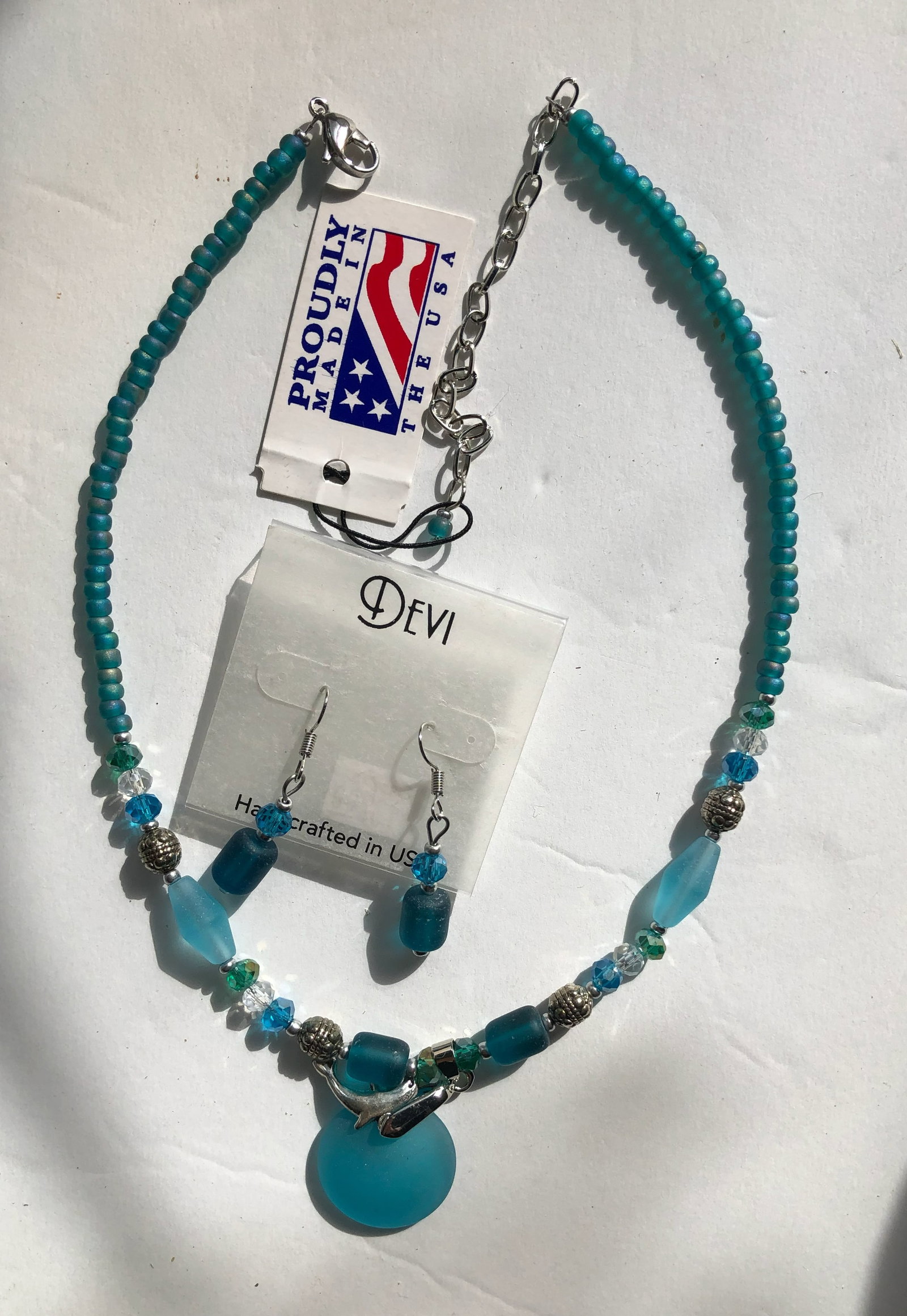 Devi Jewelry Set: Handcrafted jewelry set made in the USA, featuring a necklace and matching earrings with blue beads.