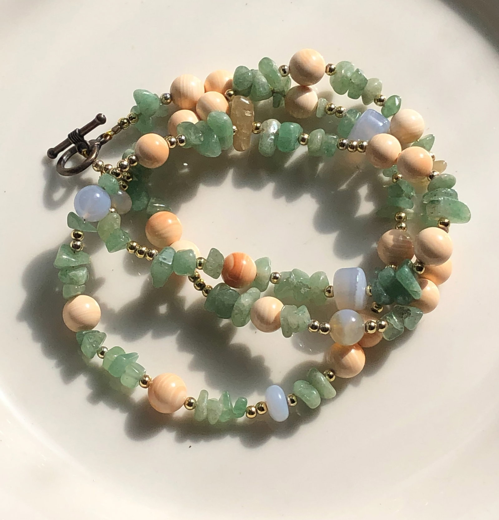 Gemstone Beaded Necklace: A beautiful handcrafted necklace featuring a mix of gemstones and beads.