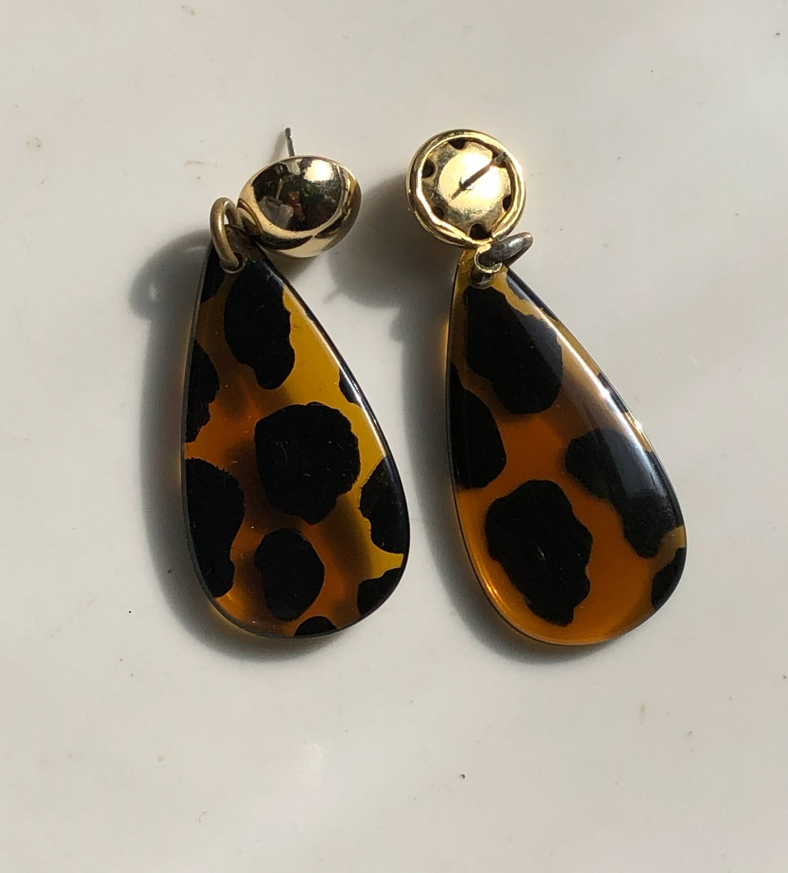 Leopard Print Earrings: Stylish leopard print earrings with gold accents.