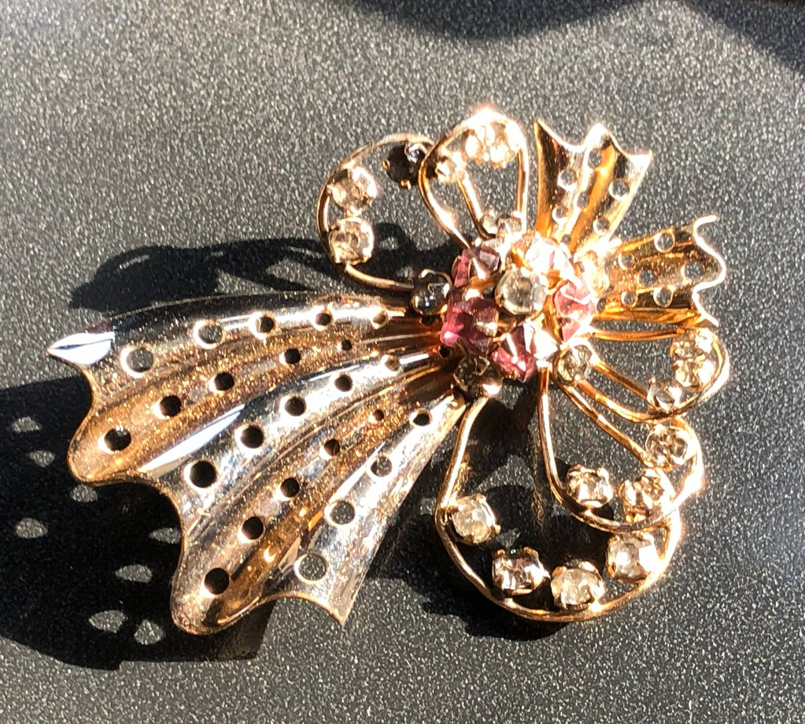 Vintage Gold Filled Brooch: A beautiful vintage Gold Filled brooch with intricate detailing and sparkling stones. Size: 2".