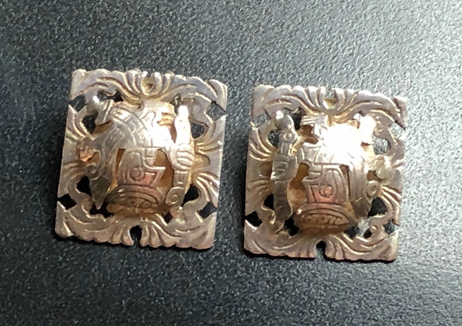 Decorative Silver Earrings: Intricately designed Silver earrings with a unique pattern.