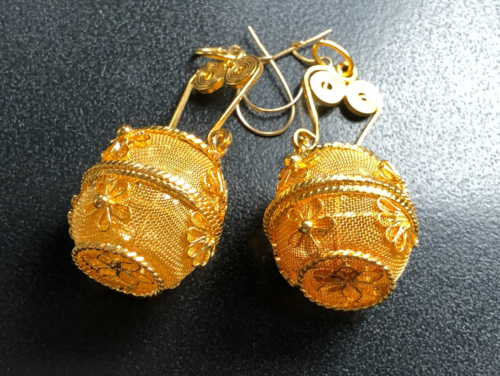 Gold Filled Earrings: Elegant gold filled earrings with intricate floral design.