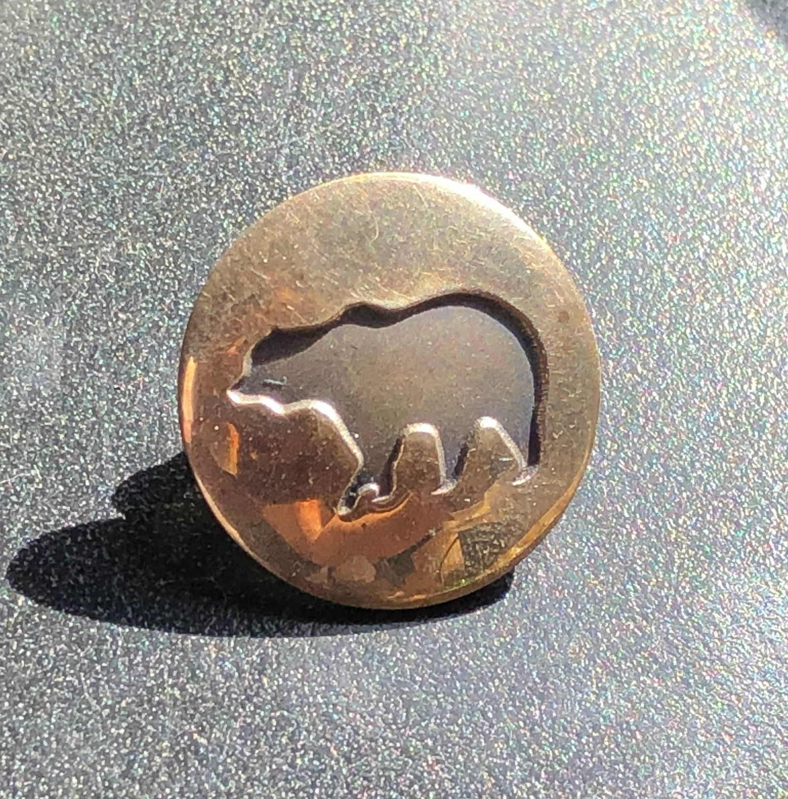 Round Silver Bear-Motif Jewelry Pin: Round Silver jewelry pin featuring a raised bear silhouette within a circular frame