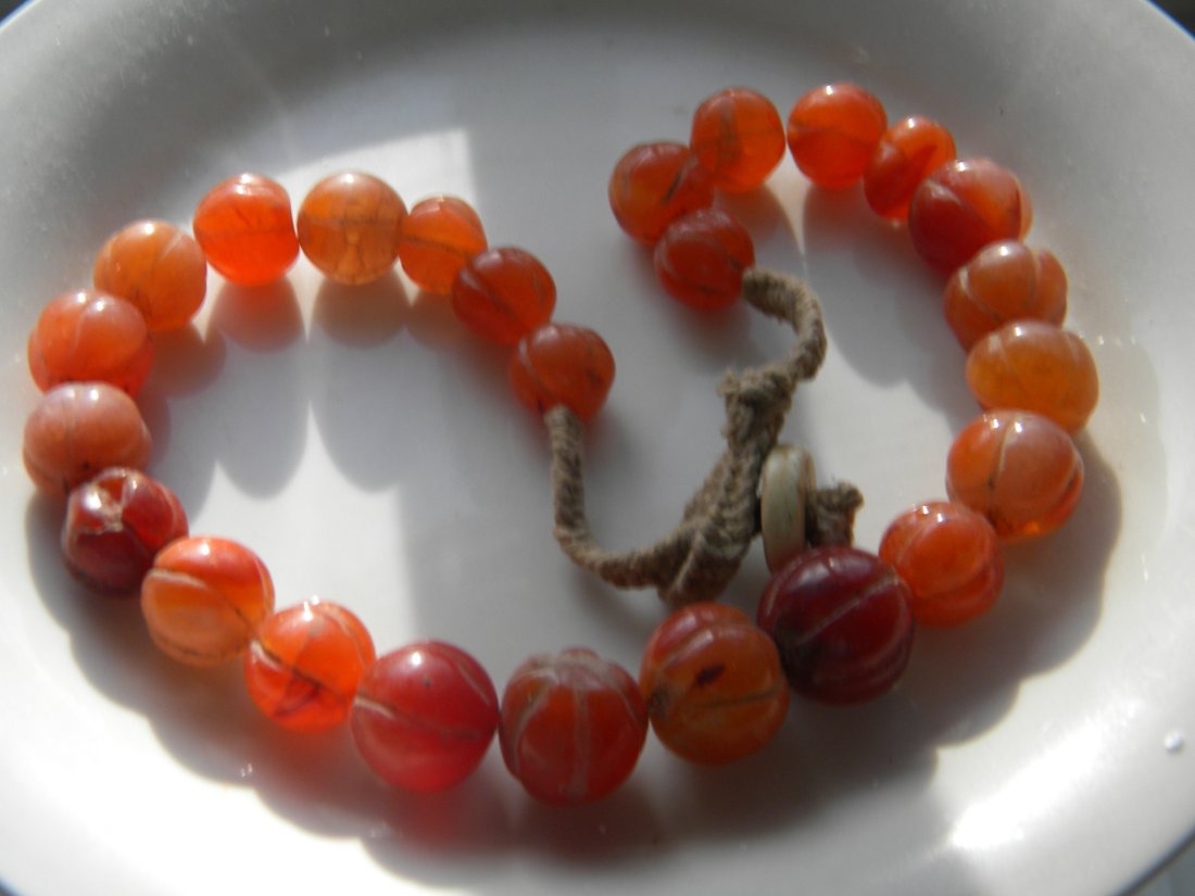 CHINESE ANTIQUE CARVED CARNELIAN MELON BEADS NECKLACE: CHINESE ANTIQUE CARVED CARNELIAN MELON BEADS NECKLACE, LENGTH: 20", LARGEST BEAD SIZE: 20mm.