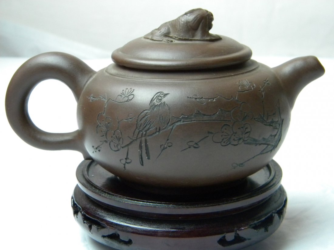 ANTIQUE CHINESE ZISHA YIXING PURPLE CLAY TEAPOT: ANTIQUE CHINESE ZISHA PURPLE CLAY TEAPOT, ONE SIDE CARVED BIRD AND FLOWER, THE OTHER CARVED CHINESE CHARACTERS. SIZE: 7.5" X4"