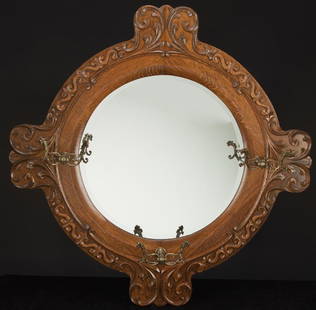 Fine antique quarter sawn oak, hanging, beveled mirror: Fine antique quarter sawn oak, hanging, beveled mirror Hat & Coat Rack in excellent finish and condition, circa 1900-1910. NOTE: The ornate trim and matching ornate hooks, 35" x 35".