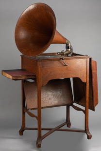 Scarce and very desirable, oak case "Victor Talking: Scarce and very desirable, oak case "Victor Talking Machine" in rare School House Model, excellent playing order, excellent original finish and condition. Removable exterior oak Horn measures 21 1/2"