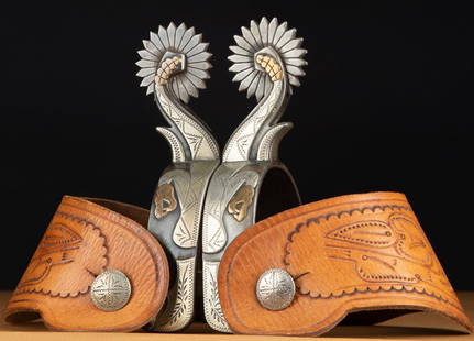 Pair of double mounted Spurs by noted Texas Bit and: Pair of double mounted Spurs by noted Texas Bit and Spur Maker Kevin Burns in the unique rattlesnake pattern with silver overlay hand engraved diamonds on opposite heel bands and engraved swing